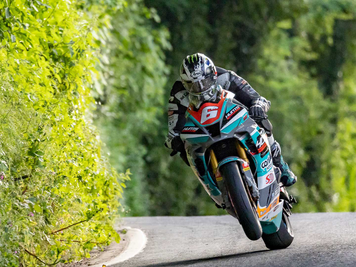 Michael Dunlop on his Superstock Suzuki 1000 tops 127 mph in Thursday’s qualifying session.