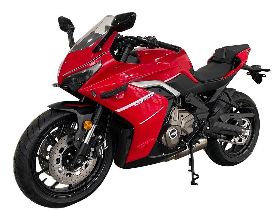 This red version looks to be the lower-spec model, though both bikes share the same frame, engine, and basic styling.