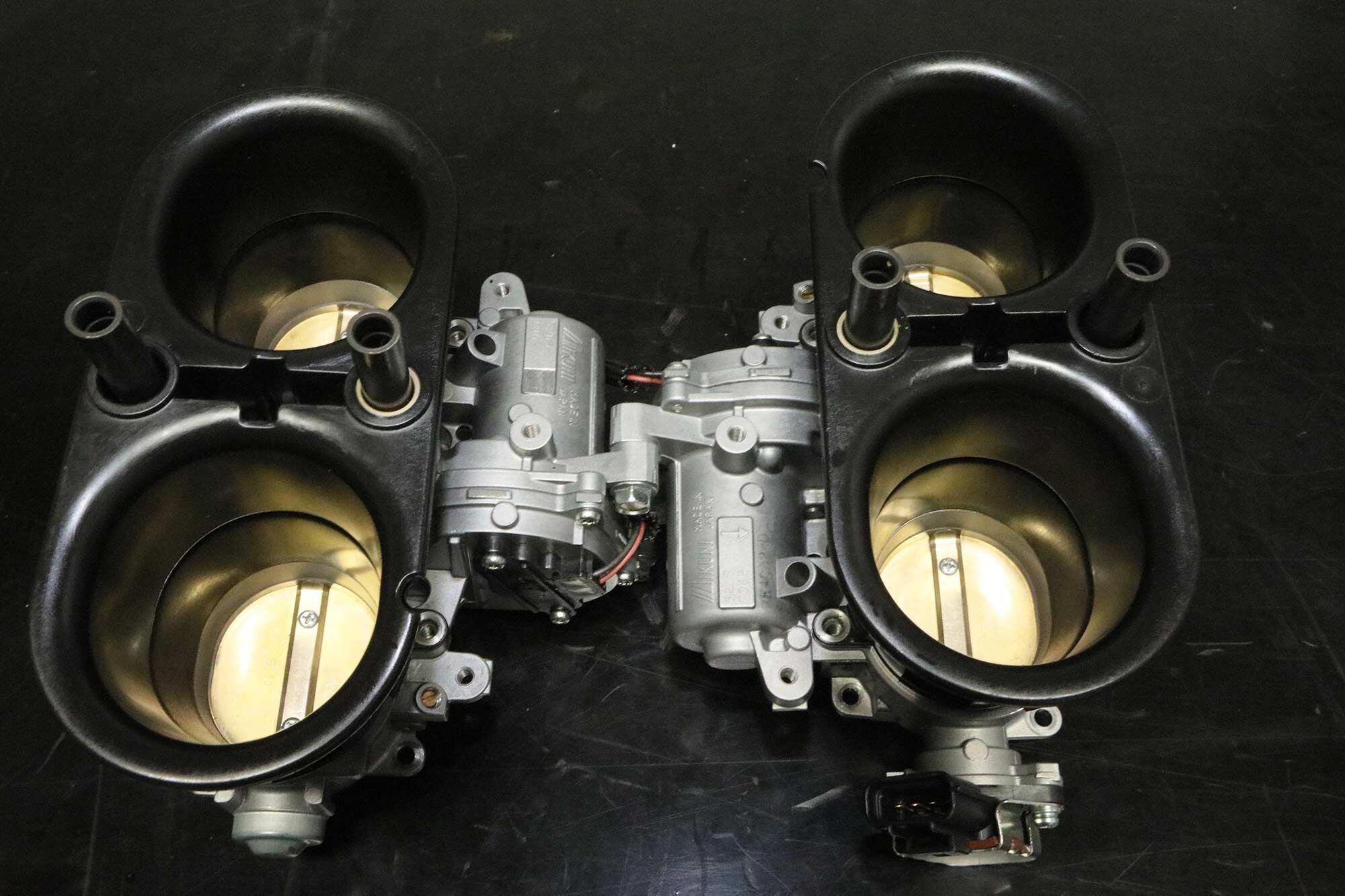 Panigale V-4 desmo throttle bodies are oval; their total surface area is equal to a round 52.5mm bore. They also feature variable geometry to enhance throttle response over a wider range of engine speeds.