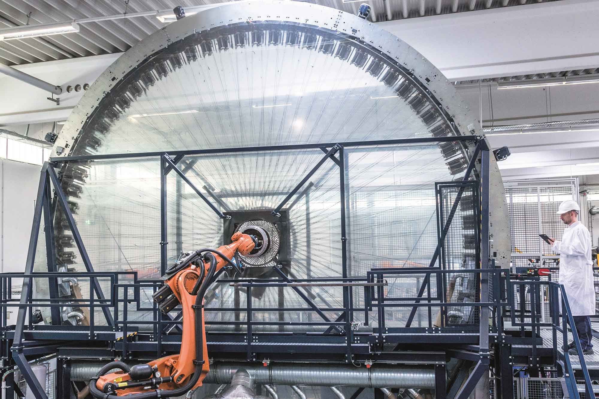 Maybe even more impressive than the wheels themselves is the lay-up machine Action Composites Hightech uses to “weave” them.
