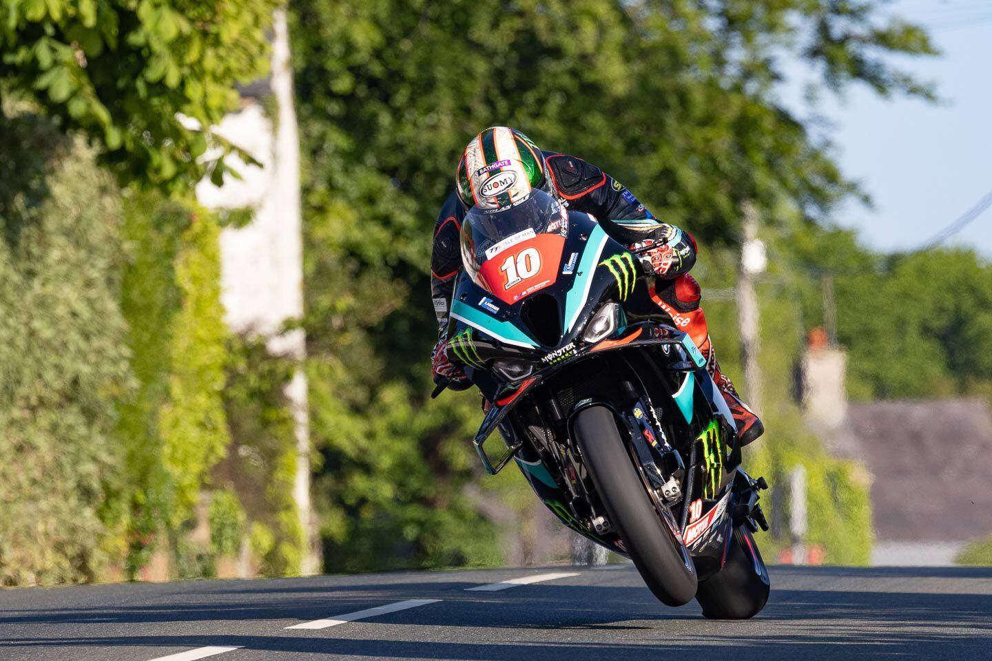The BMW RR has been Peter Hickman’s go-to bike, upon which he held the course record. Here he launches off Ballagarey, a blind dogleg to the right, riding the new M 1000 RR Superstock, exceeding the 130 mph in the early practice sessions.