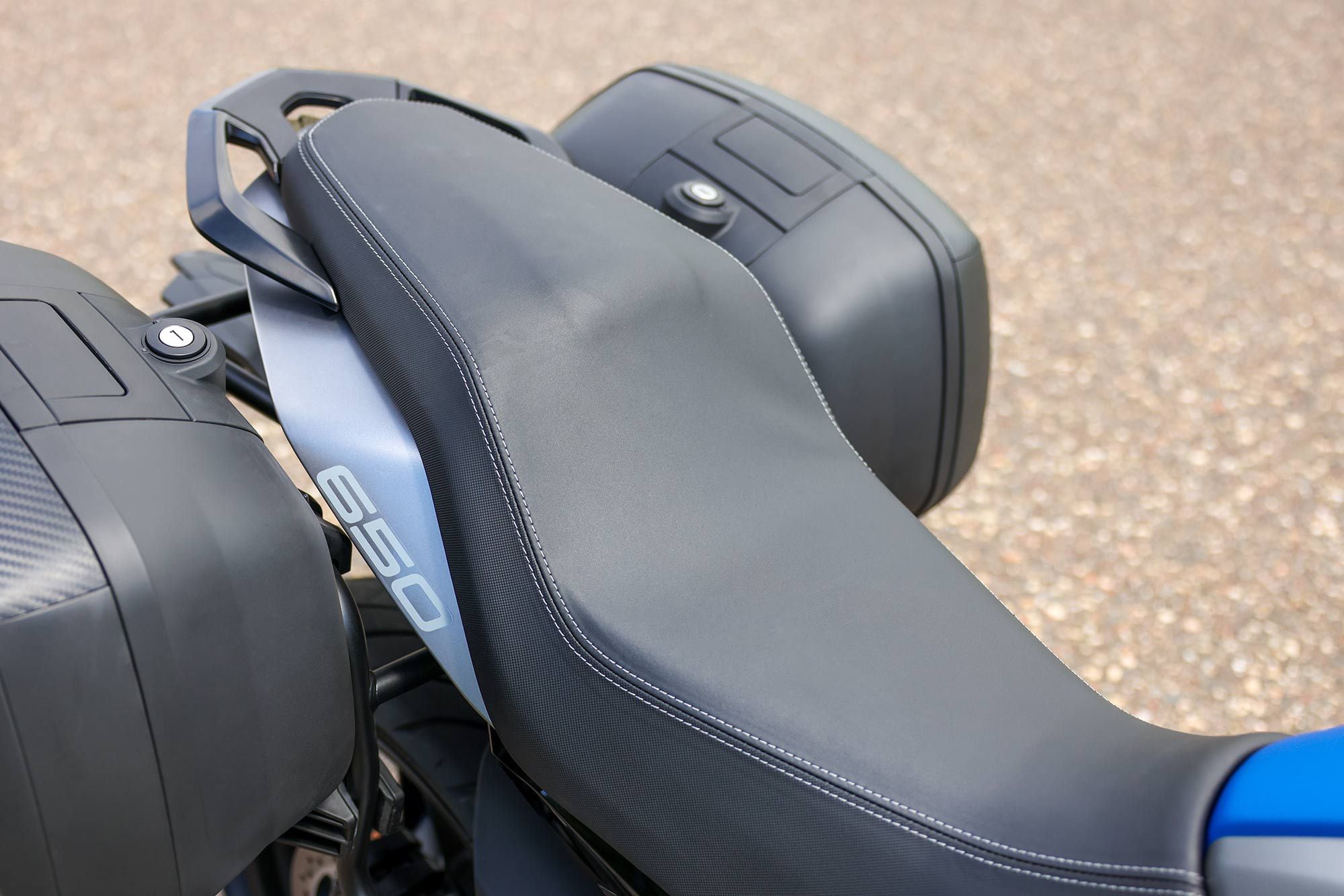 Detachable, hard-sided panniers provide adequate storage for touring, while an oversized seat offers comfort on long rides.