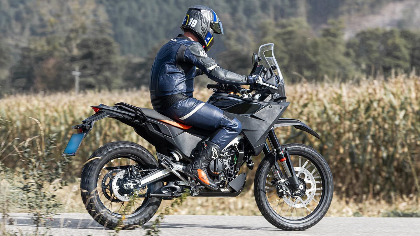 The new 390 Adventure looks far more off-road ready than the current model. Note the smooth-sided swingarm, which differs from the current 390’s deeply braced unit.