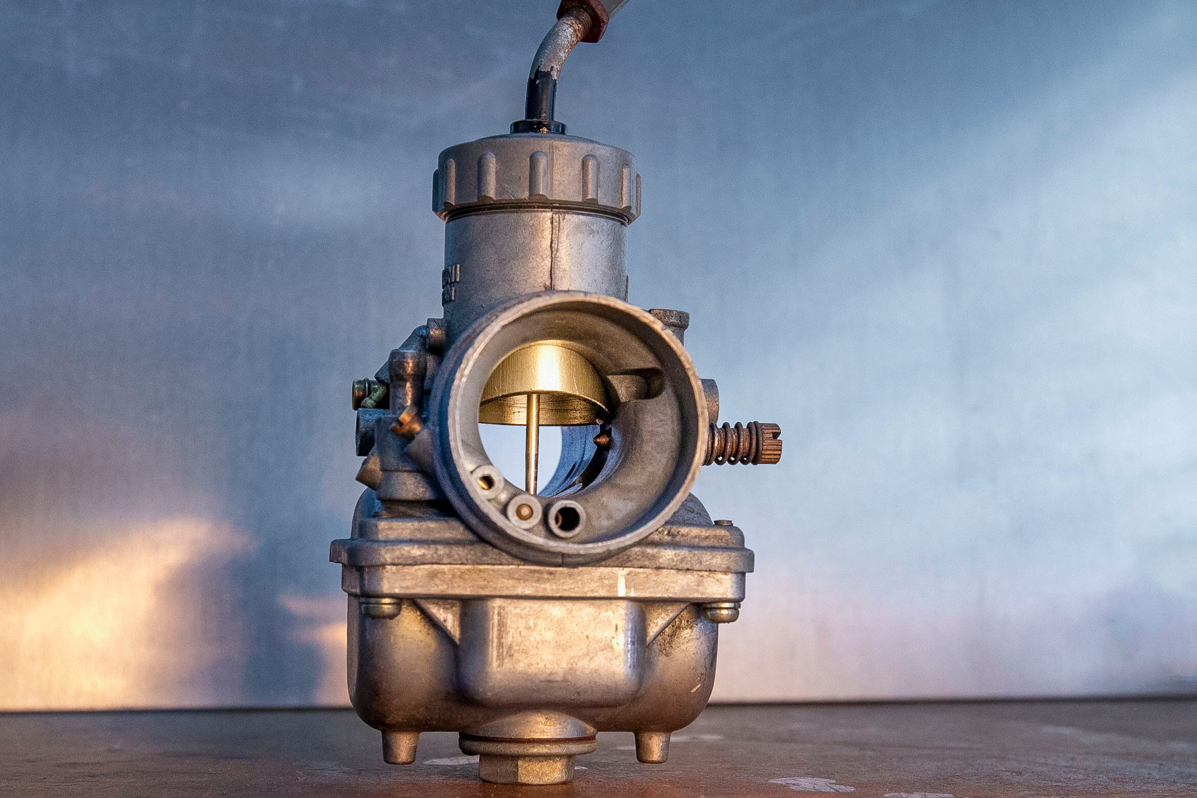 As air moves through the carburetor, fuel is pushed into the airstream.