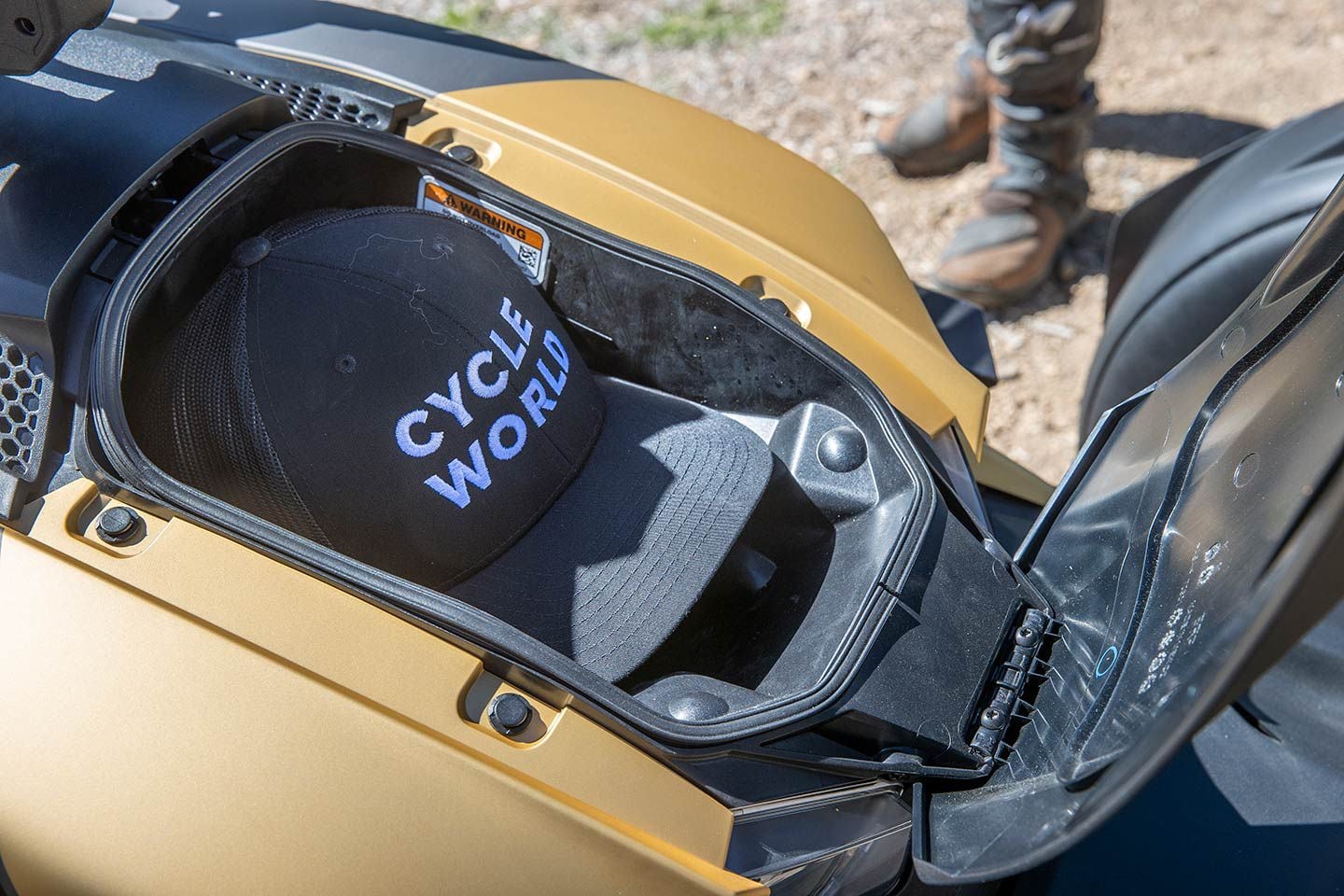 The hood has a 7-liter storage compartment and the fuel tank capacity is 5.3 gallons.