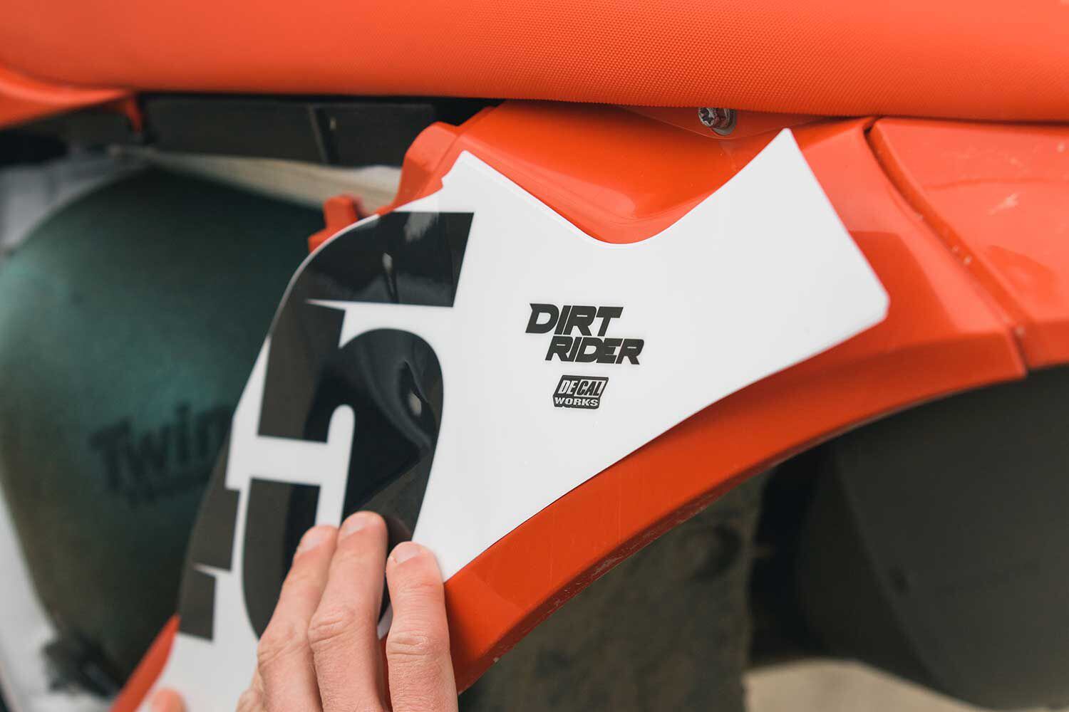 With a limited supply of bikes at the 2021 GasGas press launch, we rode the MC 250F in the morning and the MC 450F in the afternoon, which meant we had to apply graphics after the latter had been ridden on the track and was a bit dirty. After wiping down the plastics, we applied our DeCal Works preprinted number plate backgrounds, which fit perfectly and went on effortlessly.
