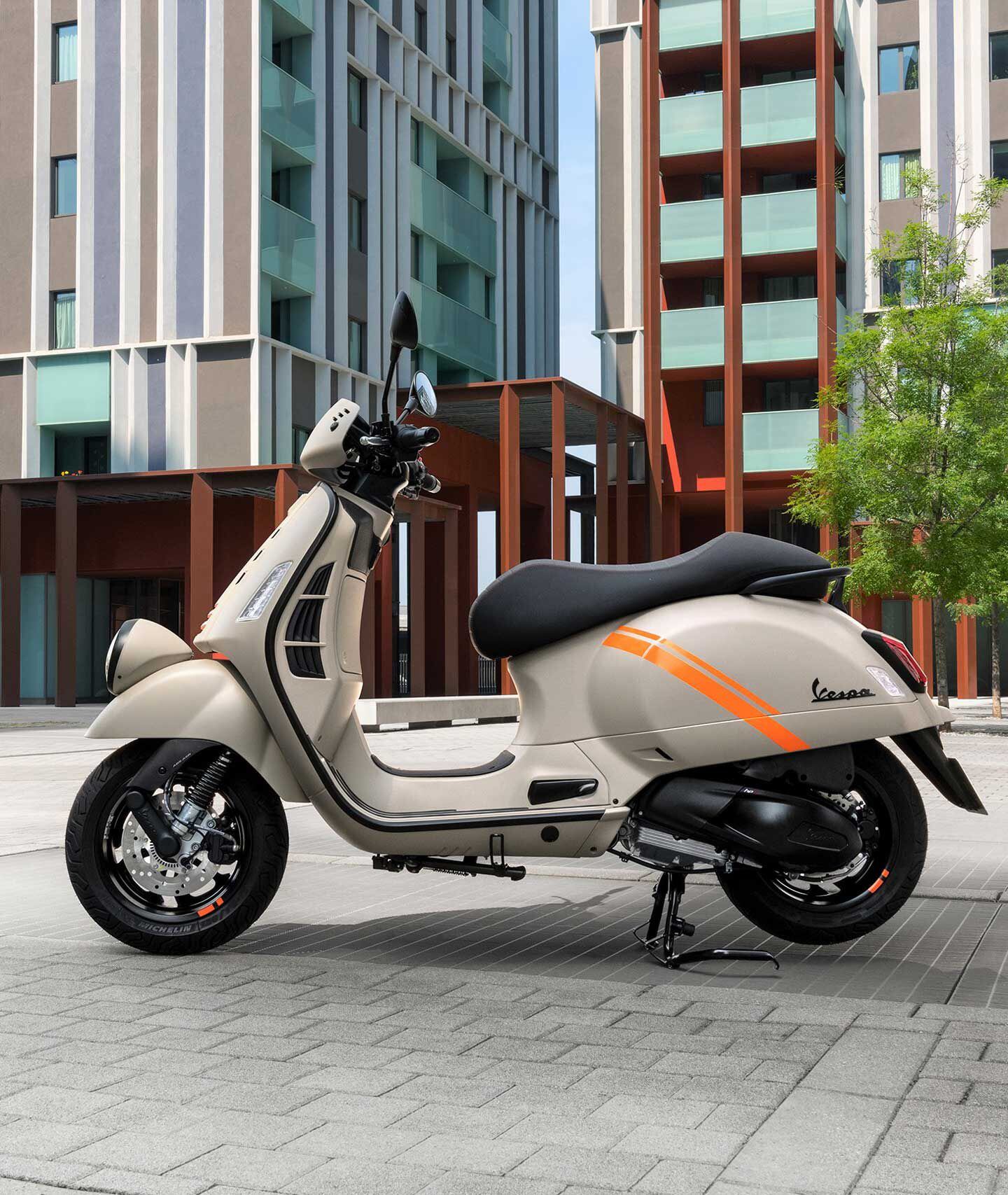 New five-spoke alloy wheels carry 12-inch tubeless rubber; rear shock is preload adjustable.