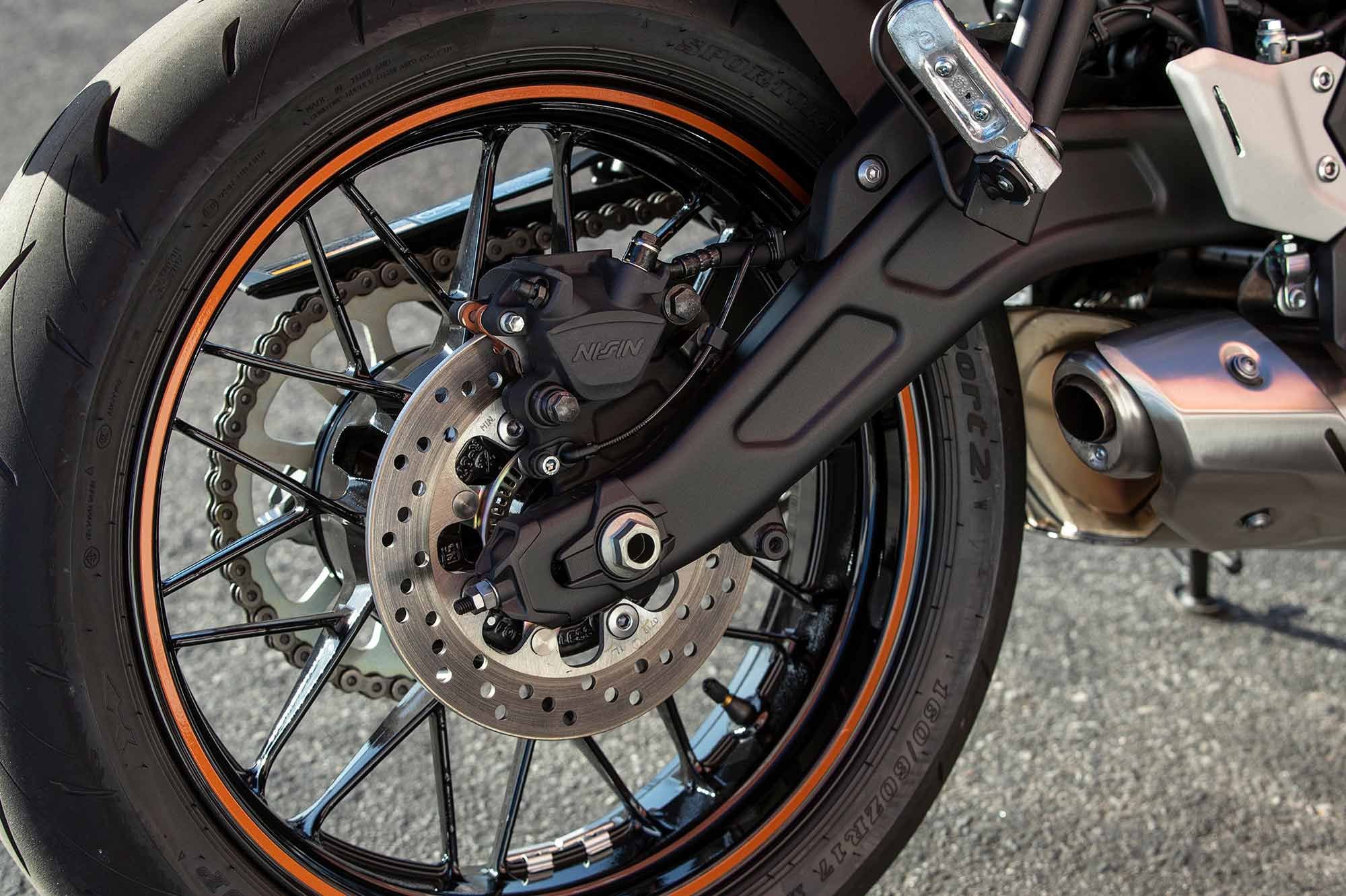 A gull-wing-type swingarm connects to a direct mount shock that strikes a balance between comfort and road-holding. The 17-inch cast wheels with spokelike design are shod with Dunlop Sportmax Roadsport 2 rubber.