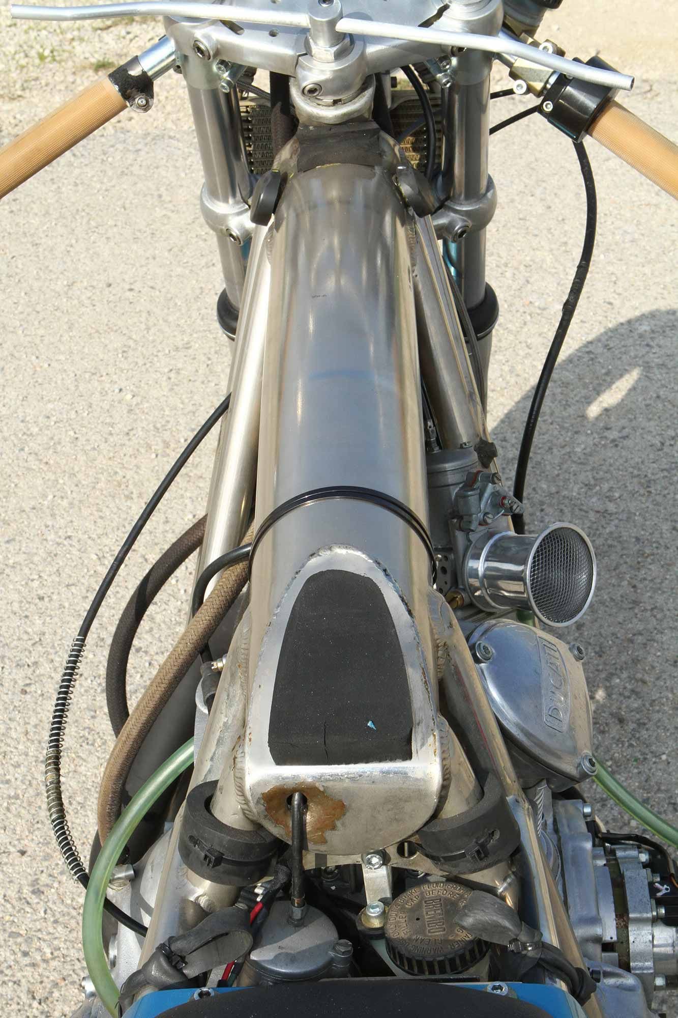 That frame backbone is a piece of steel tubing 4 inches in diameter and 1.5mm thick. Note the nickel plating. While the frame was totally Bruno dePrato’s design, he had it welded up by none other than Egli himself.
