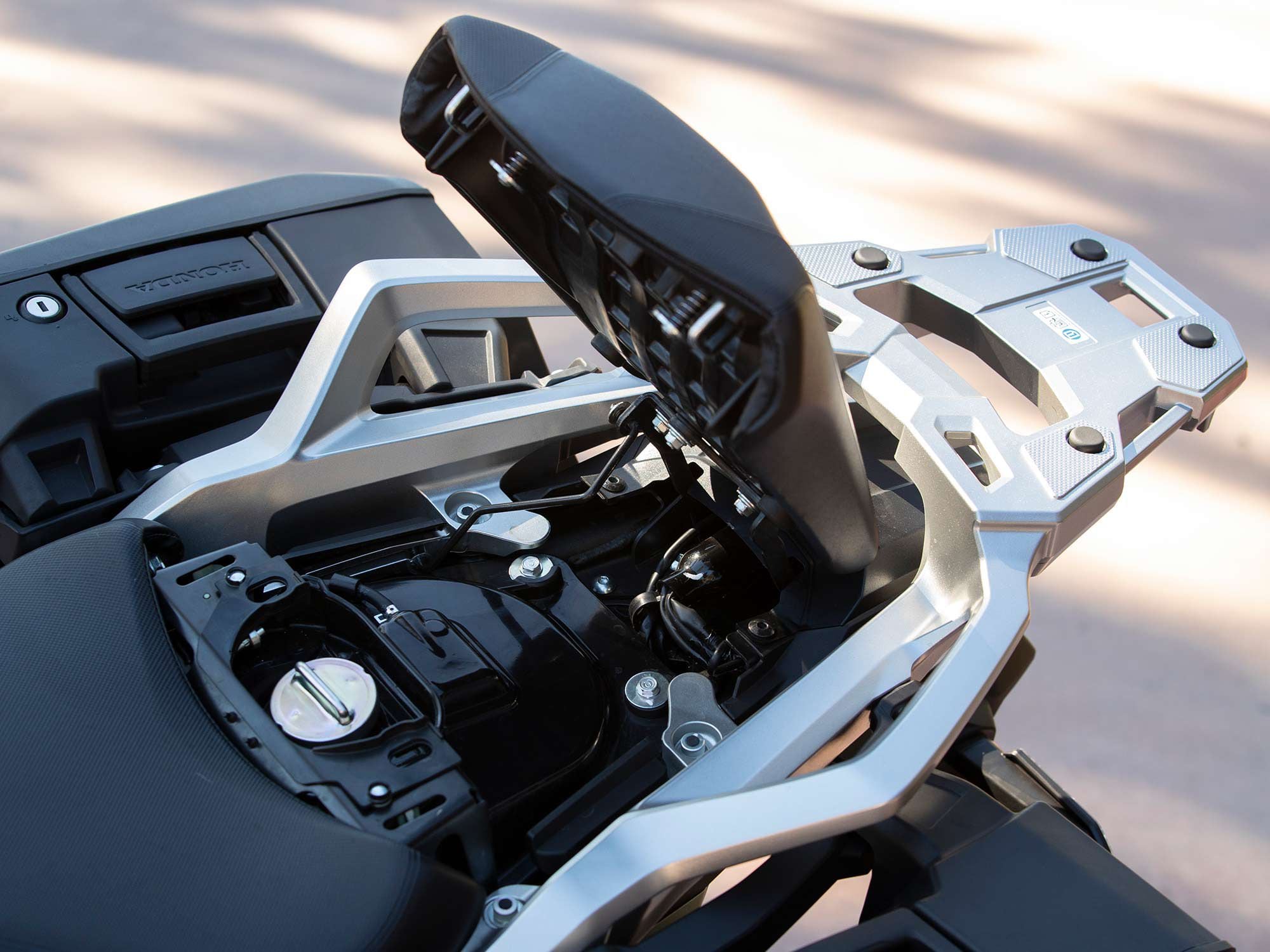 The NC750X’s fuel filler is located under the passenger seat.