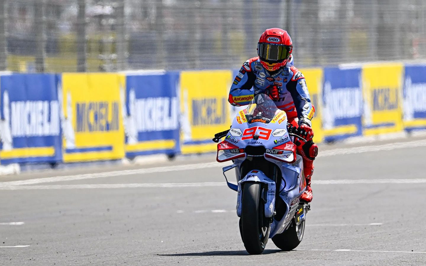 Márquez celebrating his last-lap pass and second place finish.