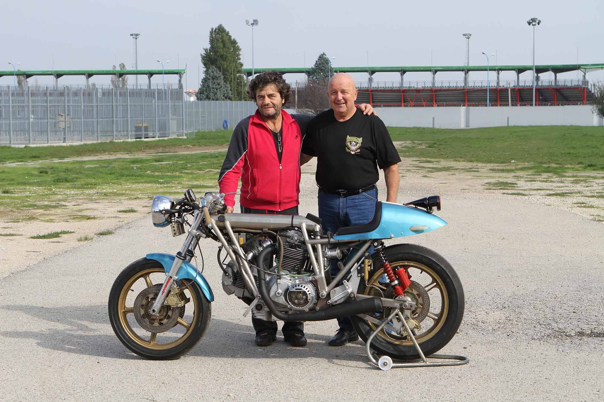 Giancarlo Rossi (left, red jacket) owns the Eagle 1 today. Here he stands with Bruno dePrato, reuniting the bike and its creator decades later. Machines like this came from a time we may never see again.