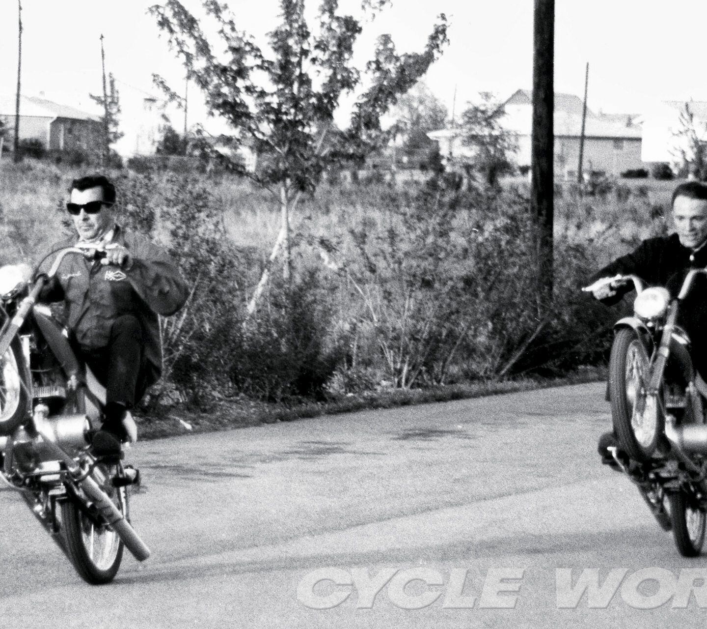 Dan Gurney and Joe Leonard doing wheelies