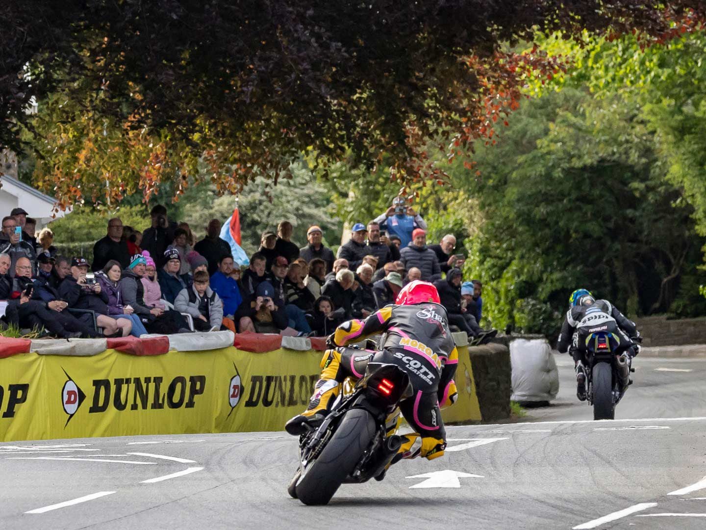 The churchyard at Braddan Bridge brings fans head on with the action on the course. For 5 pounds, spectators get a front row seat and food for purchase in the church basement.