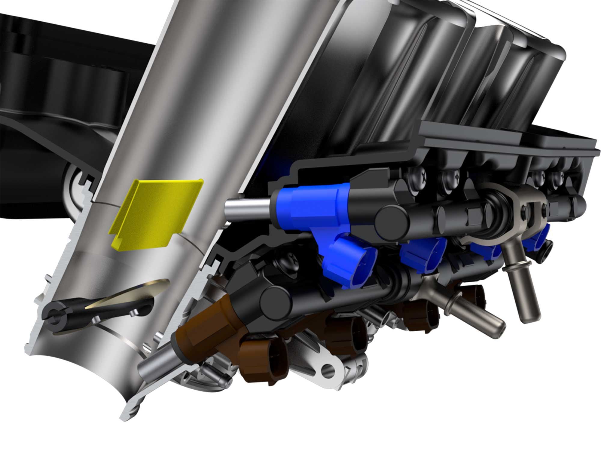 The 2022 Hayabusa’s upper fuel injectors spray against a fixed plate in the throttle body.