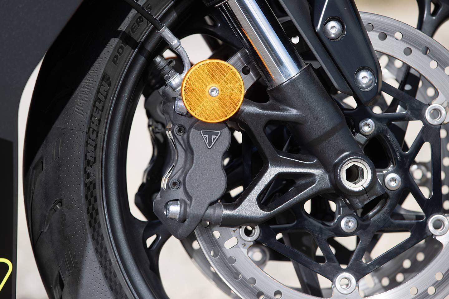 Up front are a pair of four-piston radial-mount calipers. The Showa SFF-BP fork is not adjustable.