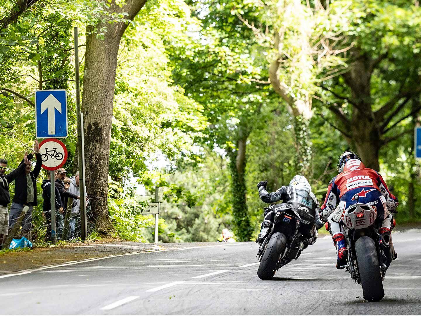 This picture encompasses 44 TT victories. Dunlop, ahead of McGuinness with 21 victories to McGuiness’ 23, takes a moment to wave to cheering fans. See you in 2023, everybody.