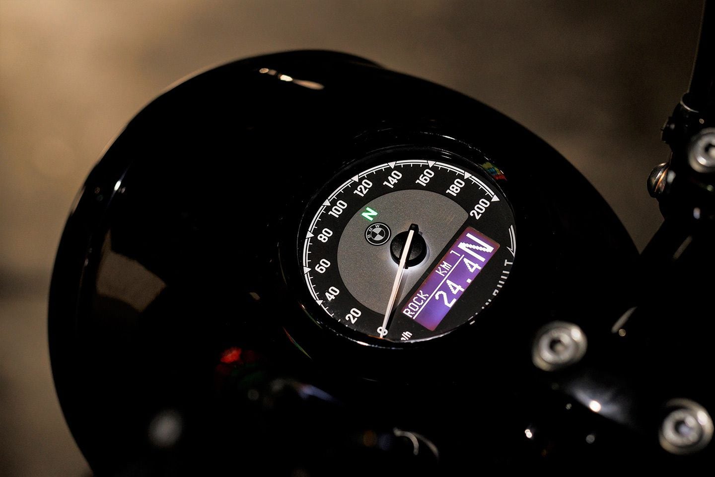 The Roctane integrates its round instrument cluster into the top of the metal headlight housing for a clean, classic look.
