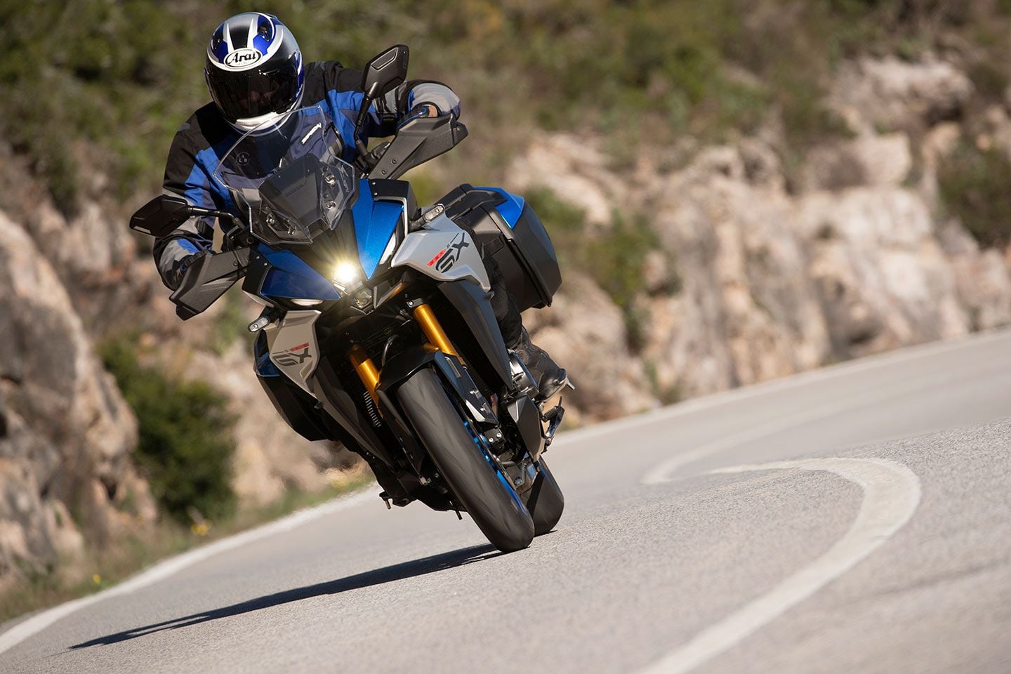The GX+ is better described as stable than agile, but don’t fully discredit this bike on a winding backroad. Notice the vent holes on the multilayered body panels, which are claimed to enhance straight-line stability.