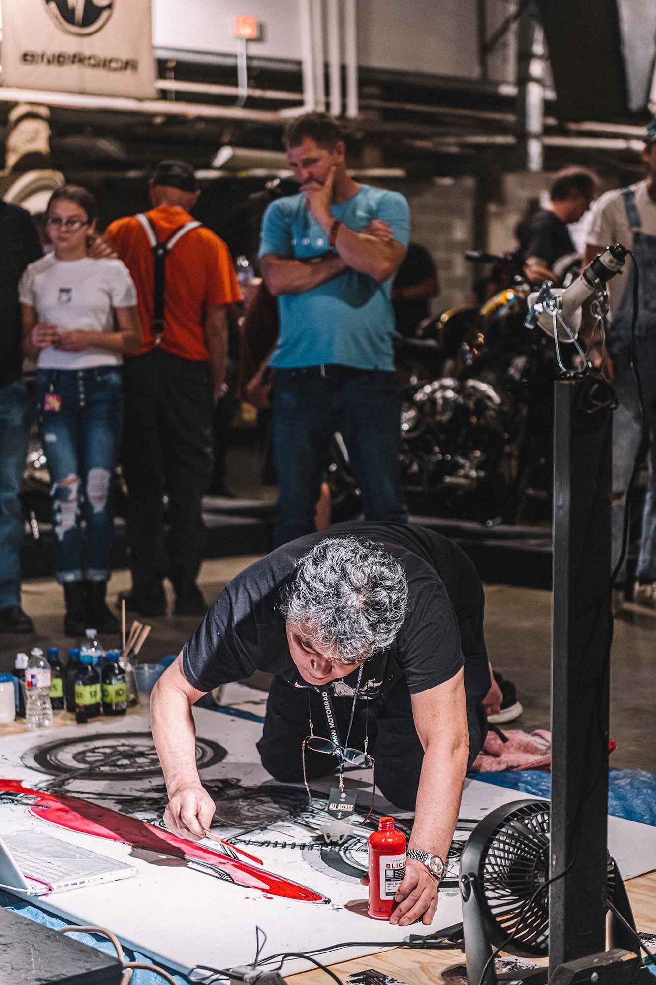 Makoto Endo painting live at the Handbuilt Show, as he has done for years.