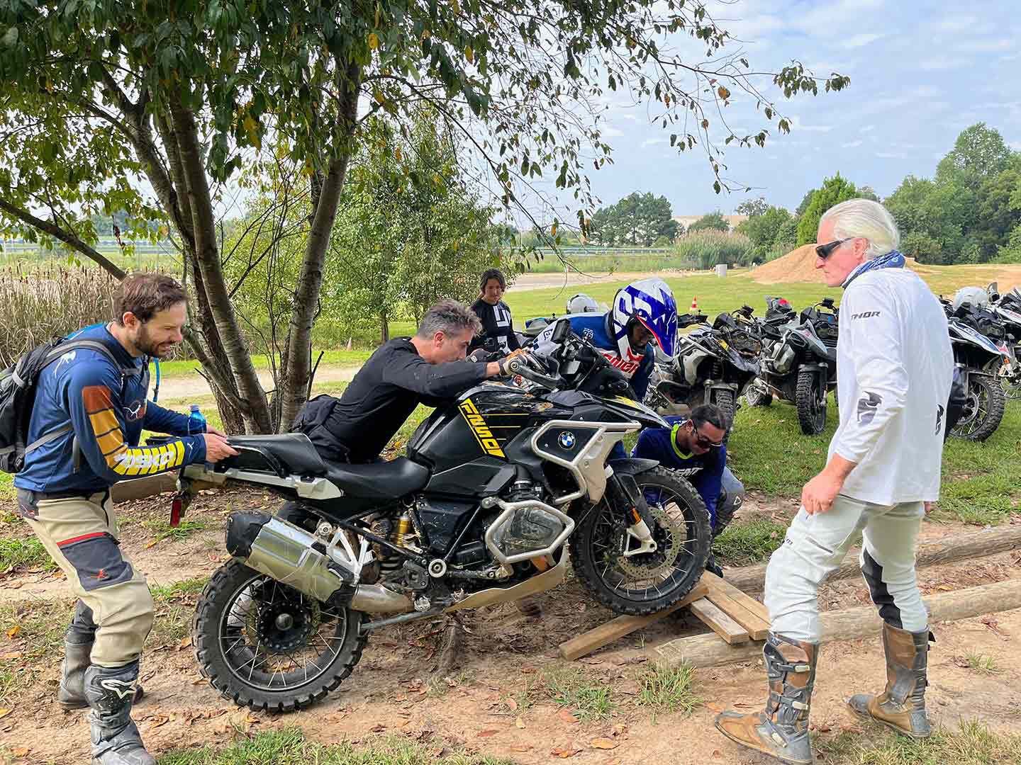 Using four wood planks as a bridge. Communication was critical to get the GS across without dropping a wheel in the gap.