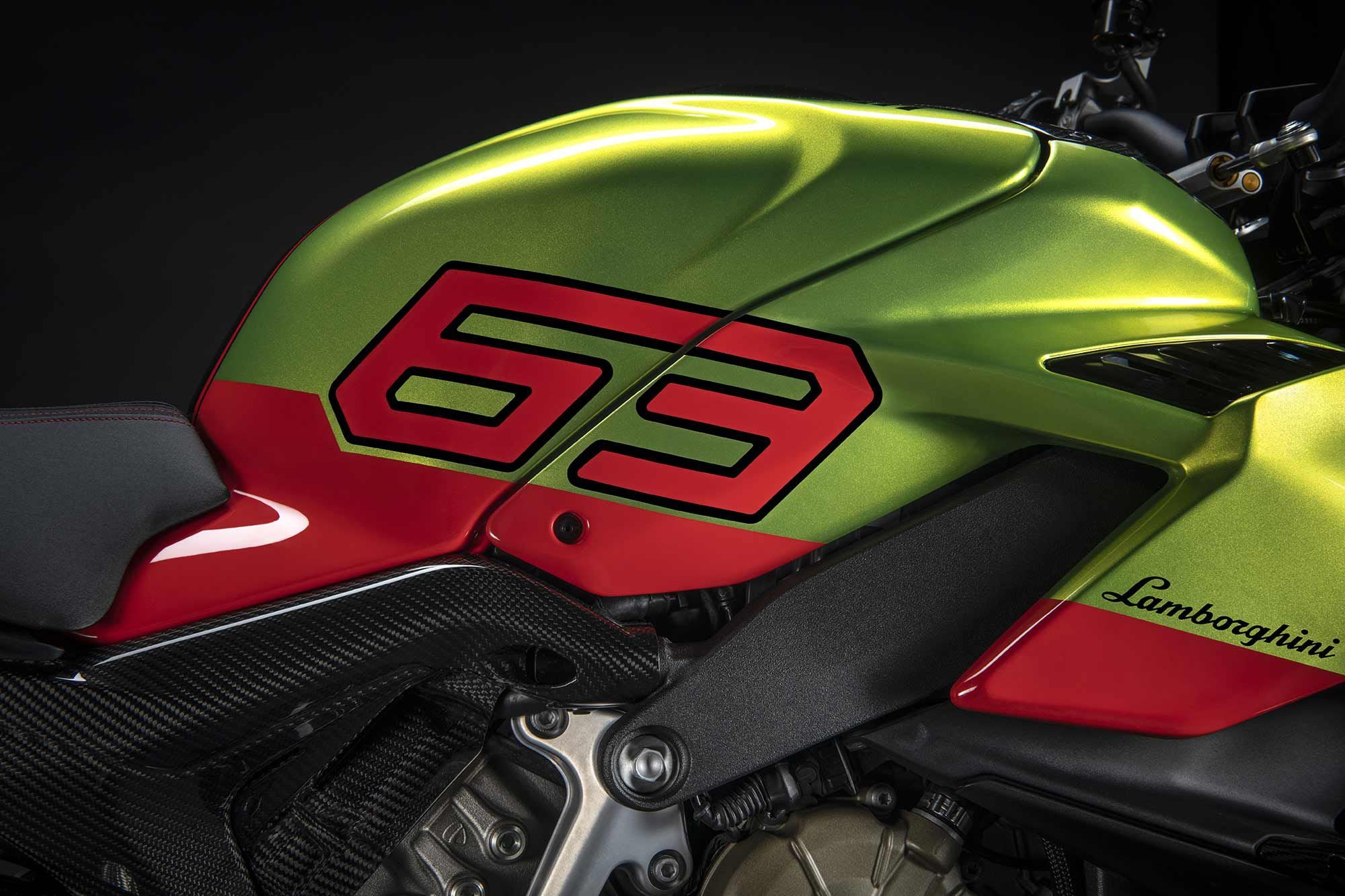 The V4 Lambo’s tank in Verde Citrea over Arancia Dac, with Pecco Bagnaia’s racing number prominently displayed.