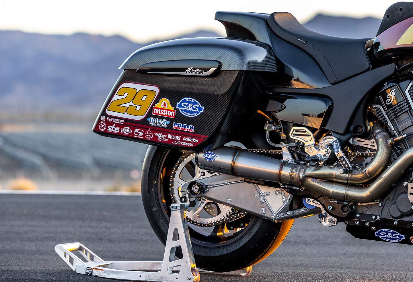 There is a stock Challenger swingarm behind all of that bracing. Saddlebags are carbon fiber. Notice also the custom seat by Saddlemen, and how the rearsets are mounted where the stock passenger pegs would normally be.