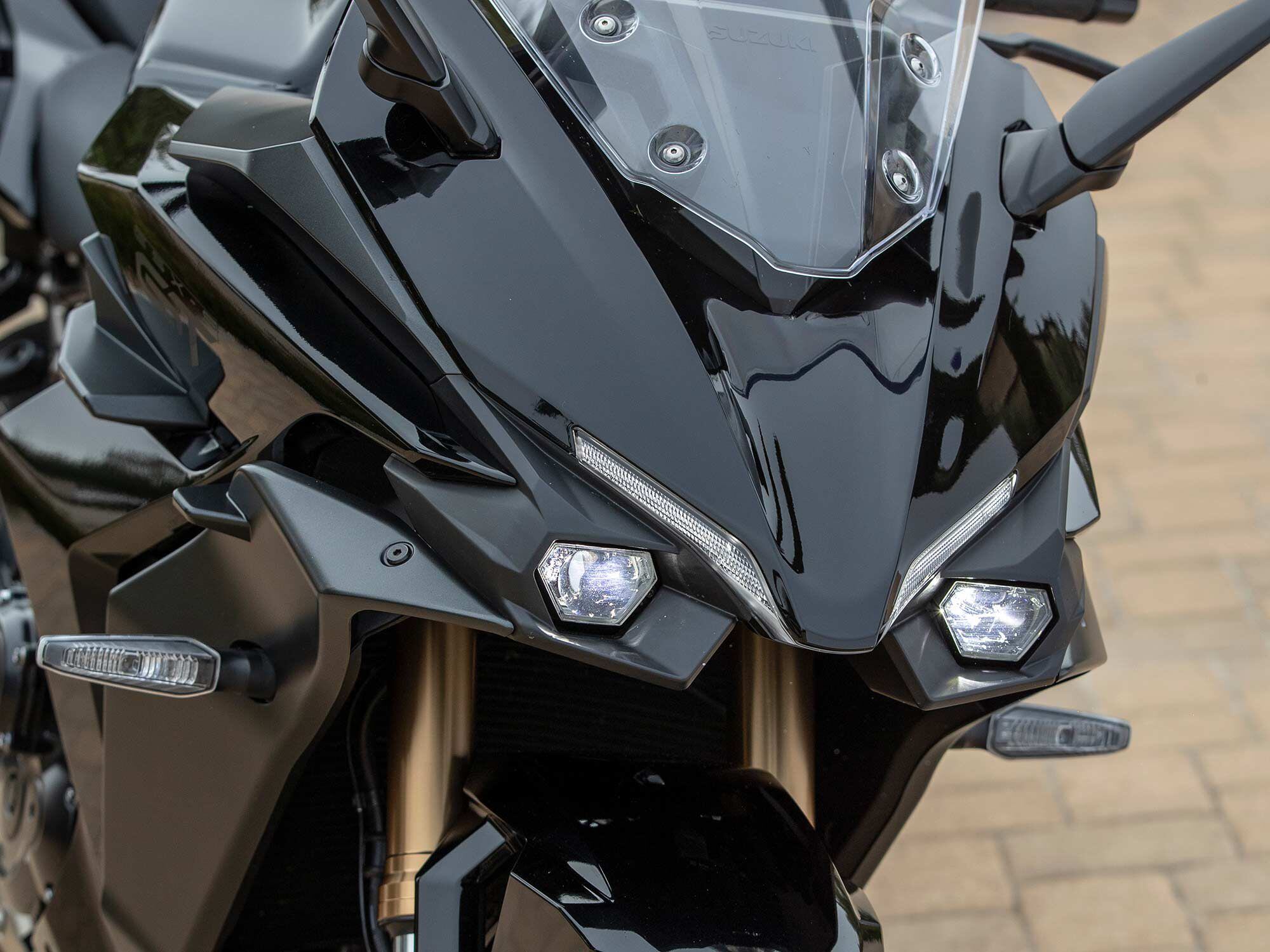 The GT’s independent, high- and low-beam headlights use mono-focus LED technology that shines light directly through a convex lens to light the road. With a GT+ and V-Strom behind me, it was readily apparent how much stronger the GT+ headlights were.