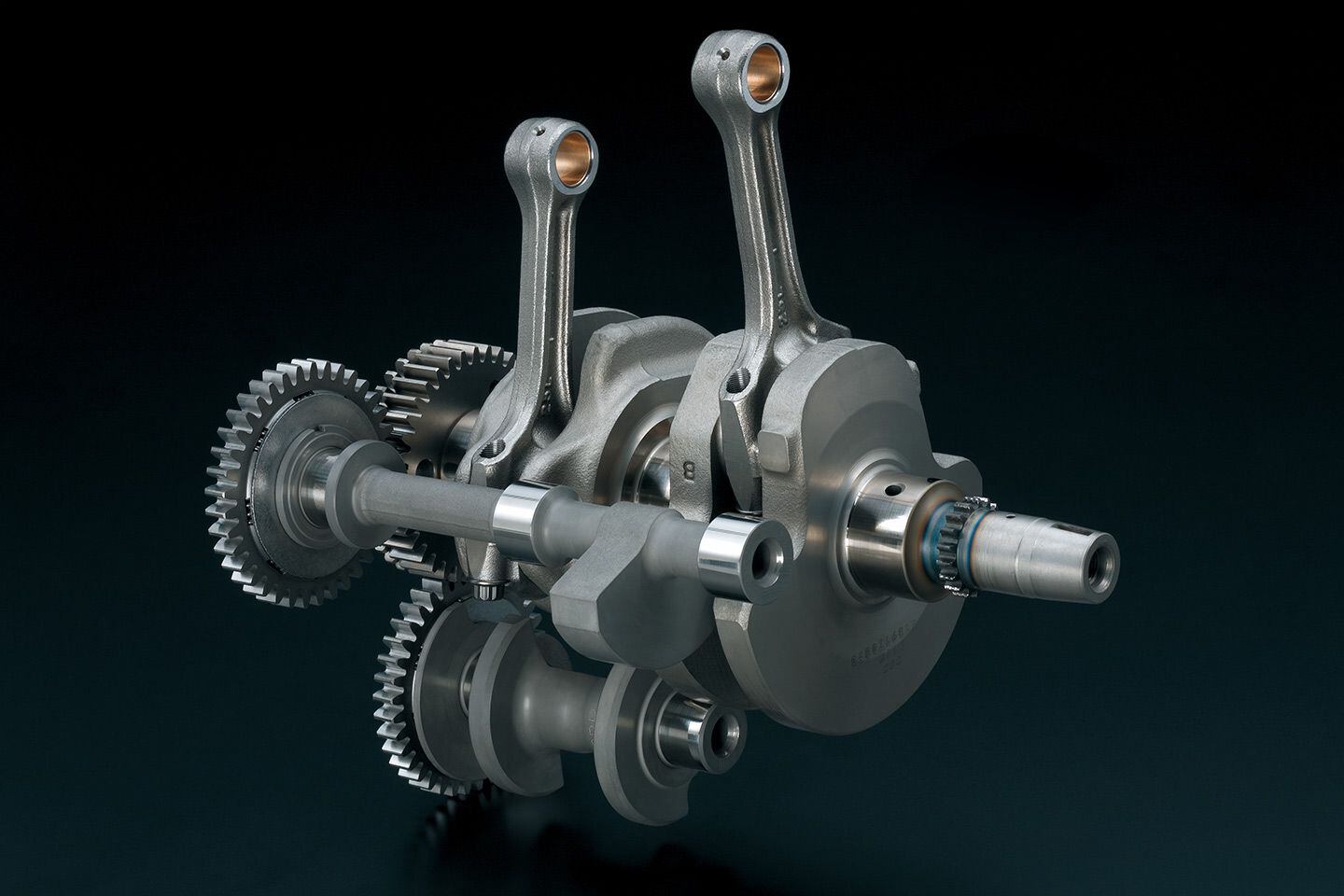 Suzuki Cross Balancer Technology places a pair of balance shafts, driven off the crankshaft, in a very compact arrangement.