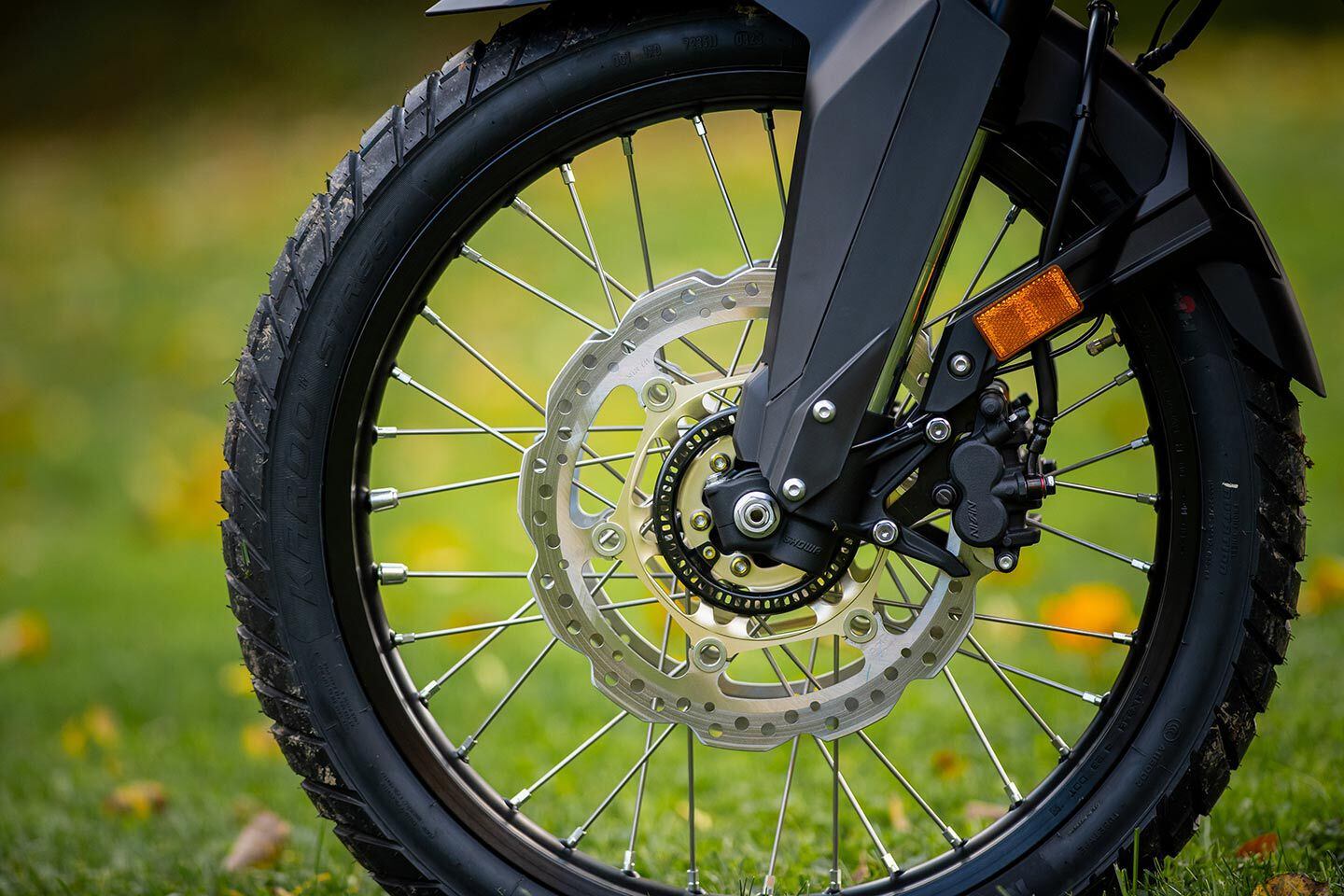 Dual 310mm discs with dual-piston calipers have a strong initial bite.