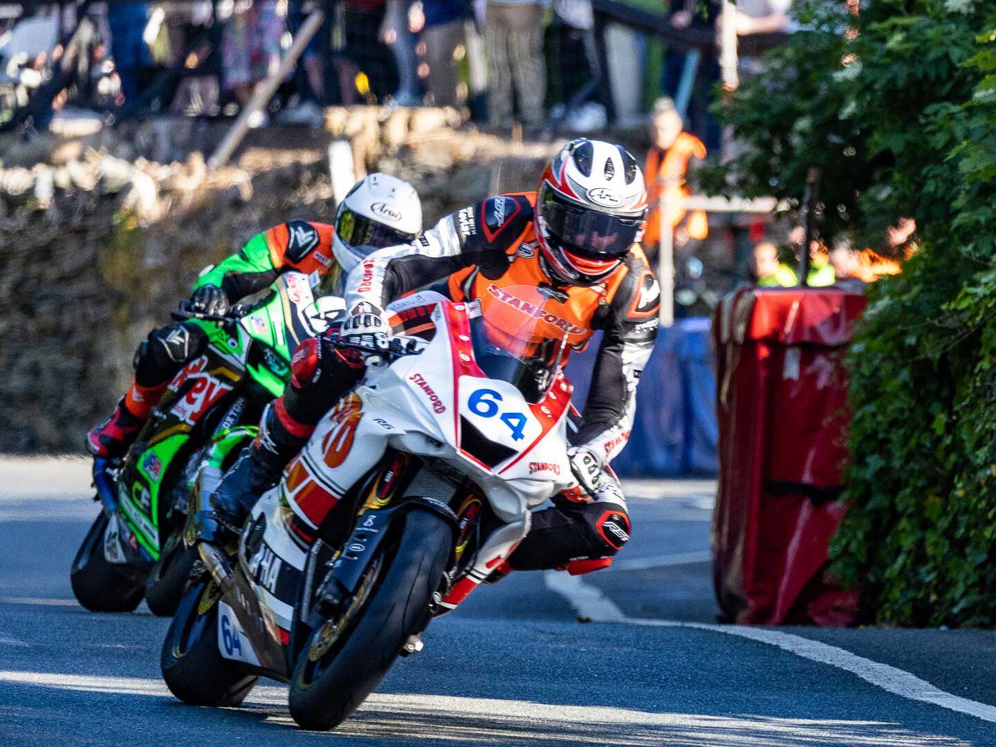 Manx rider Jorge Halliday wears orange to denote his TT rookie status. Halliday successfully completed both Superport races on his Yamaha.