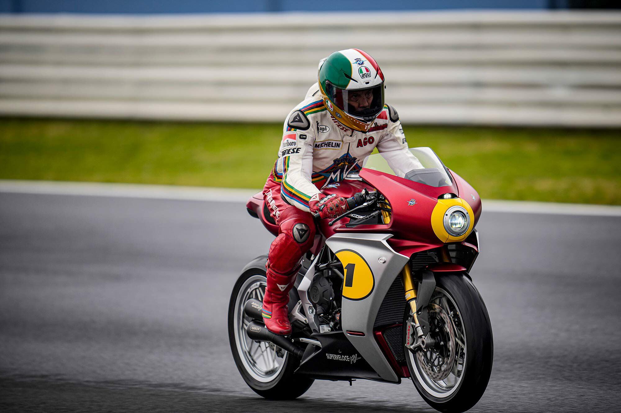 Only the helmet gives it away. Agostini still fits into his leathers, and rides like a world title depends on it. No racer is tied as closely to MV as Ago.