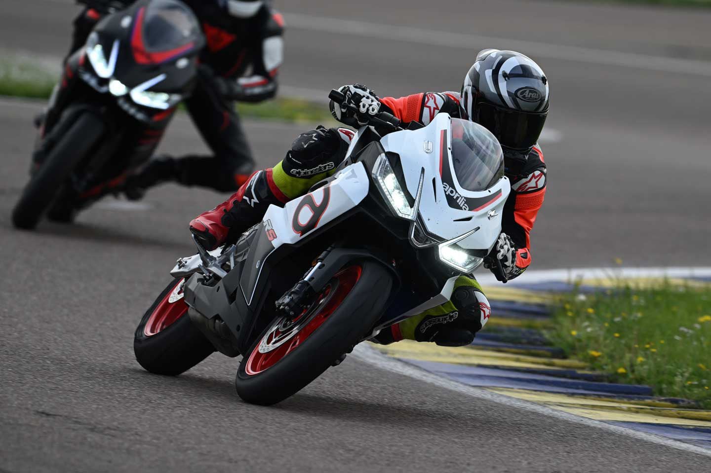 During our test at Autodromo di Modena the RS 457′s 17-inch wheels were fitted with aftermarket Pirelli Supercorsa V4 SP tires on warmers, adding to the sportbike’s impressive front end feel.