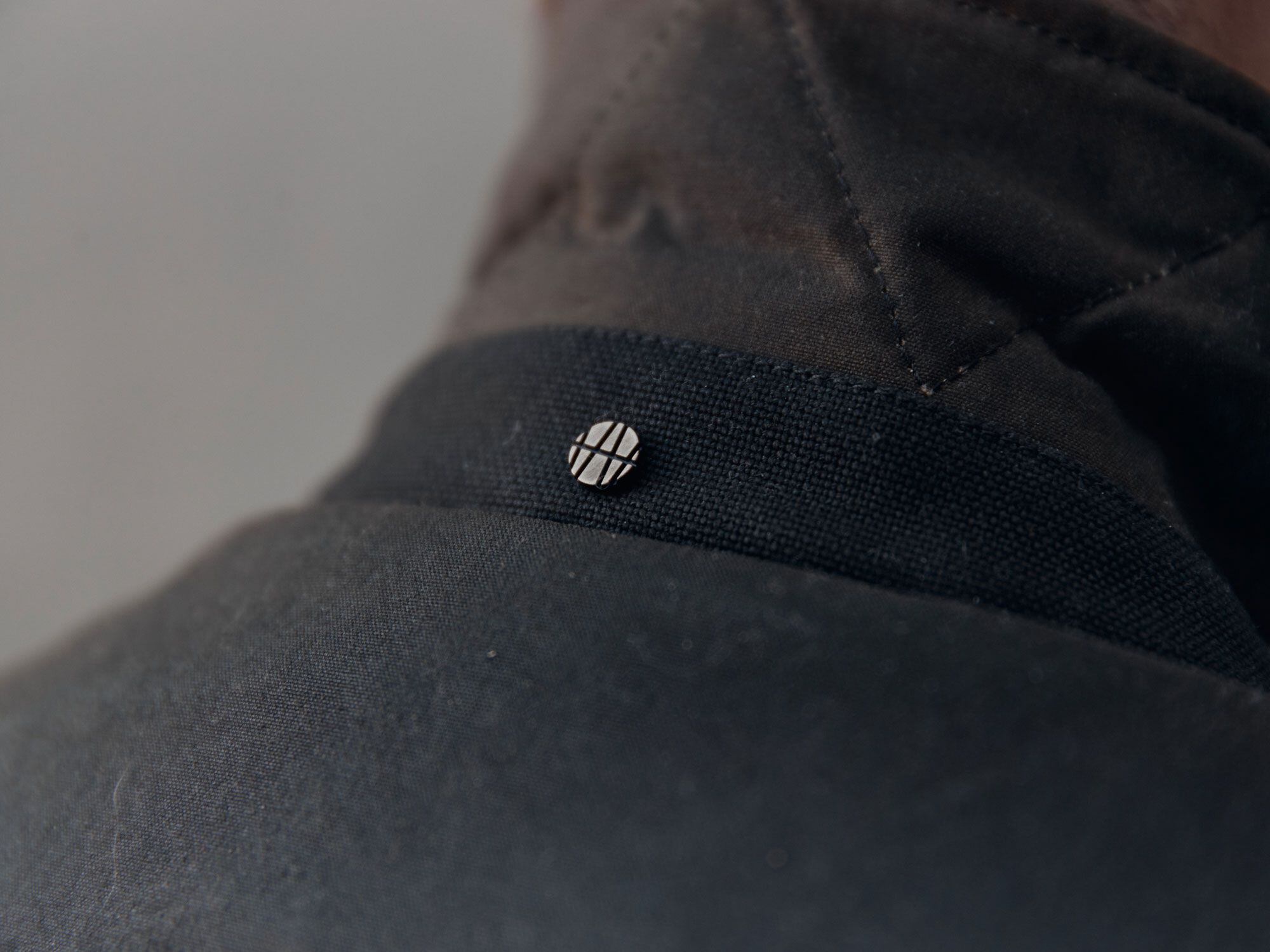 Branding on the Eversholt jacket is minimal, but a small Ashley Watson logo rivet sits on the back of the collar of each piece.
