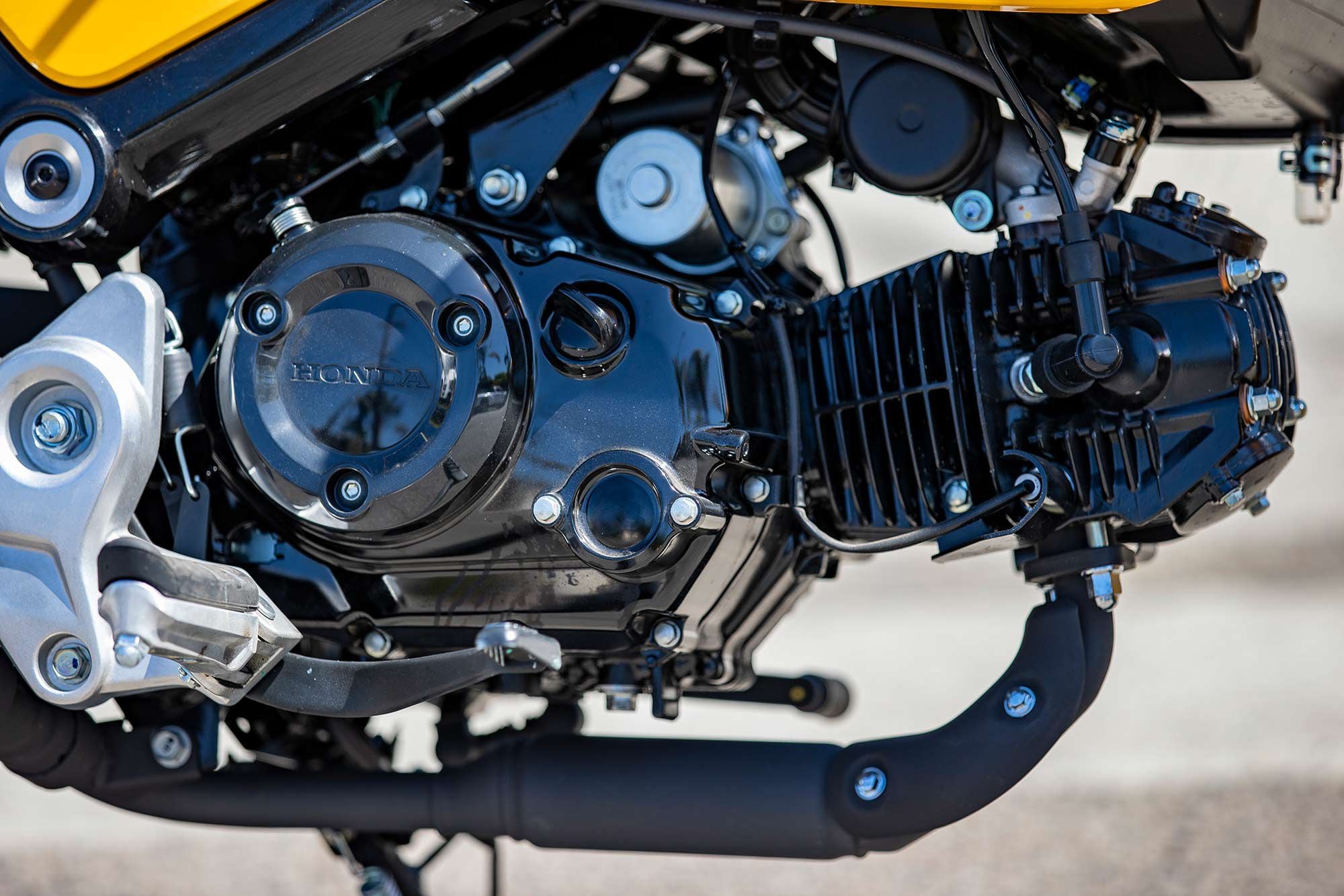 The most notable updates for the 2022 Grom happen inside the engine, with higher compression, new bore and stroke dimensions, and the addition of a fifth gear.