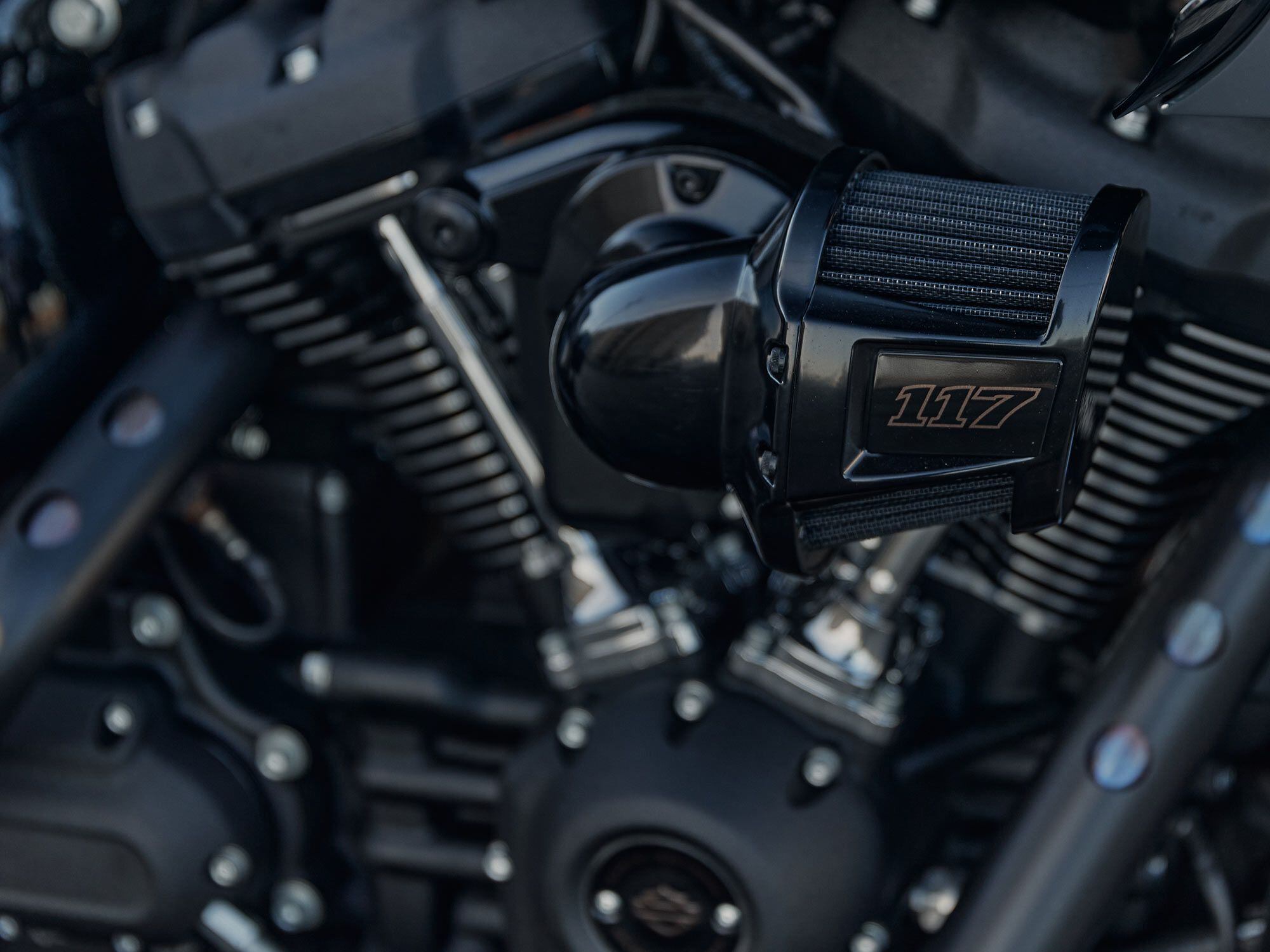 A forward-facing Heavy Breather air intake improves airflow compared to previous S models, but with mid-mounted foot controls, it would hit my knee.