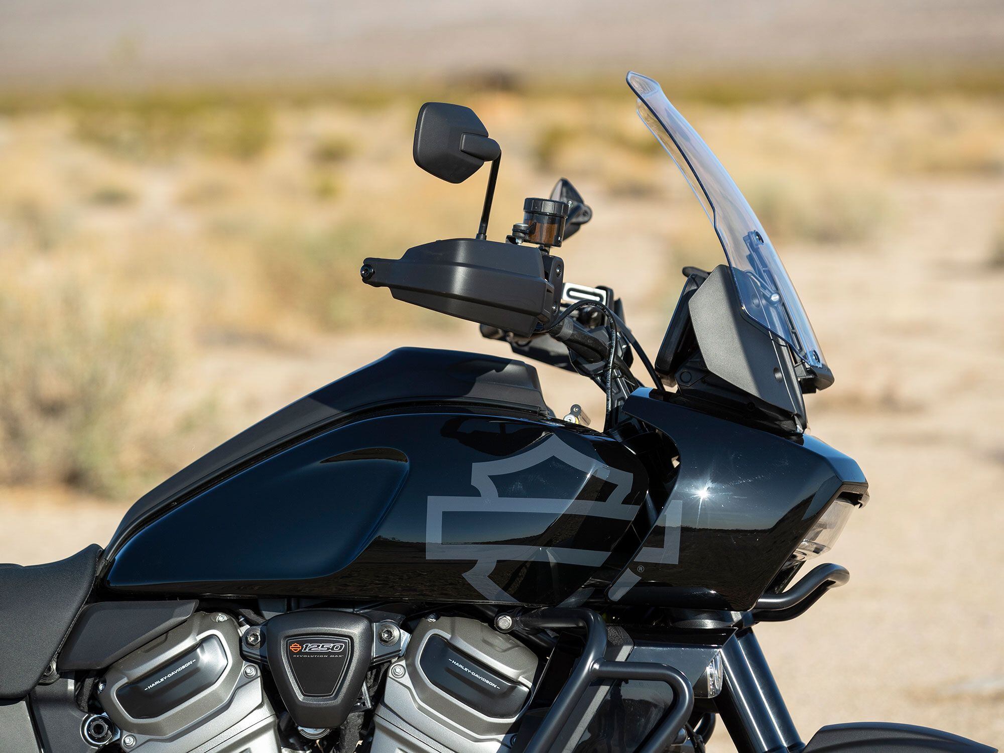 The well-shaped windscreen provides a turbulence-free rider air pocket, but the adjustment mechanism on our test unit stopped functioning after a hard day of off-roading.
