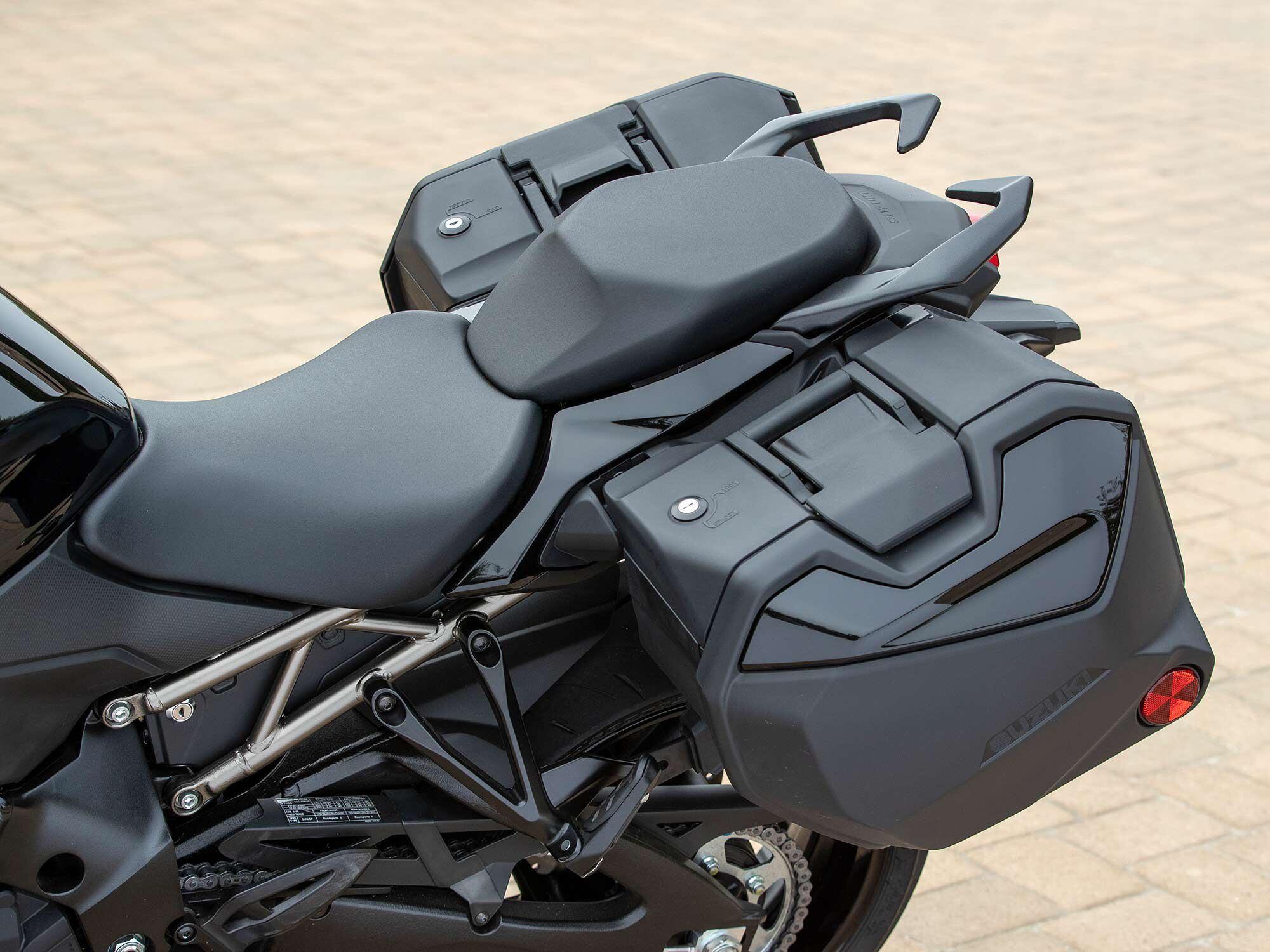 Color-matched 36-liter hard cases come standard on the GT+ and are extremely easy to remove. Notice the relatively small surface area of the otherwise comfortable-looking passenger seat.