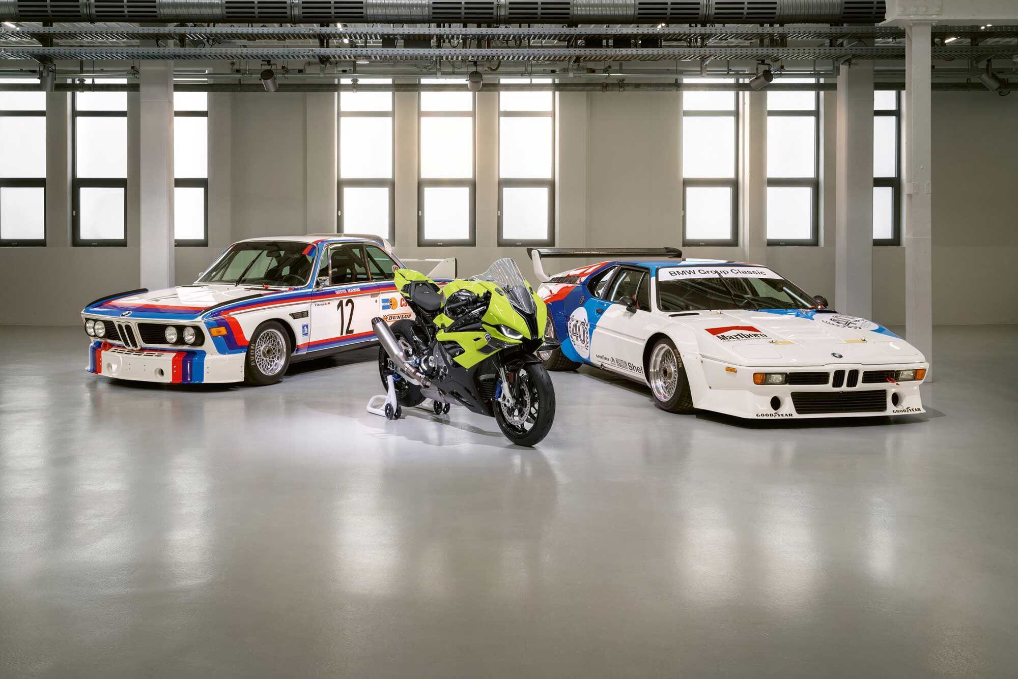 Here's the M 1000 RR 50 Years M alongside two classic BMW M series automobiles.