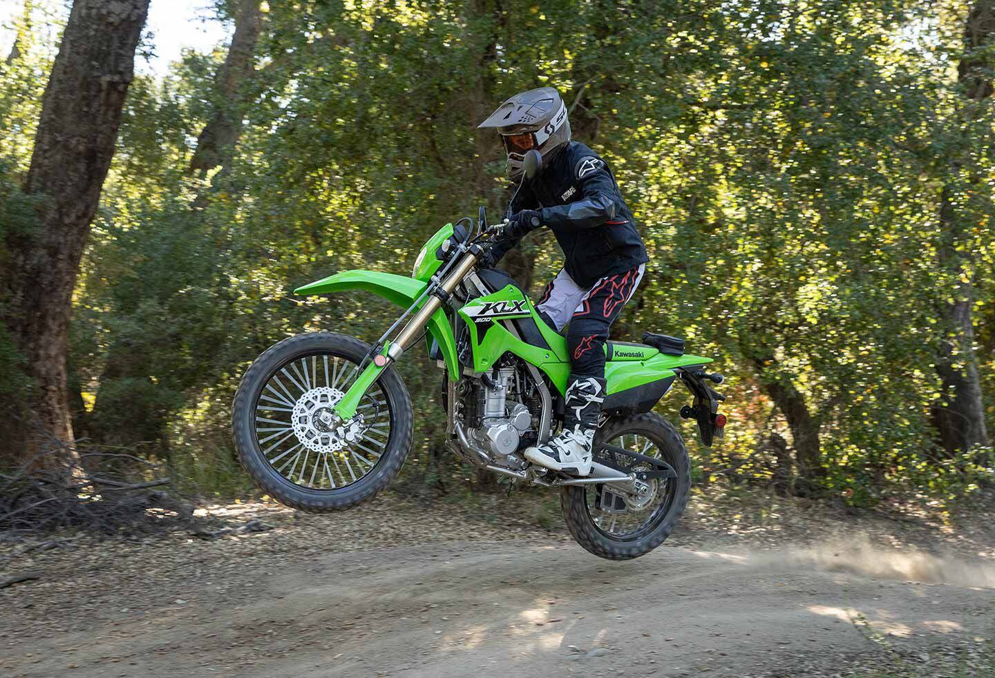 The KLX300’s playful chassis allows the rider to hop and bop down the trail.