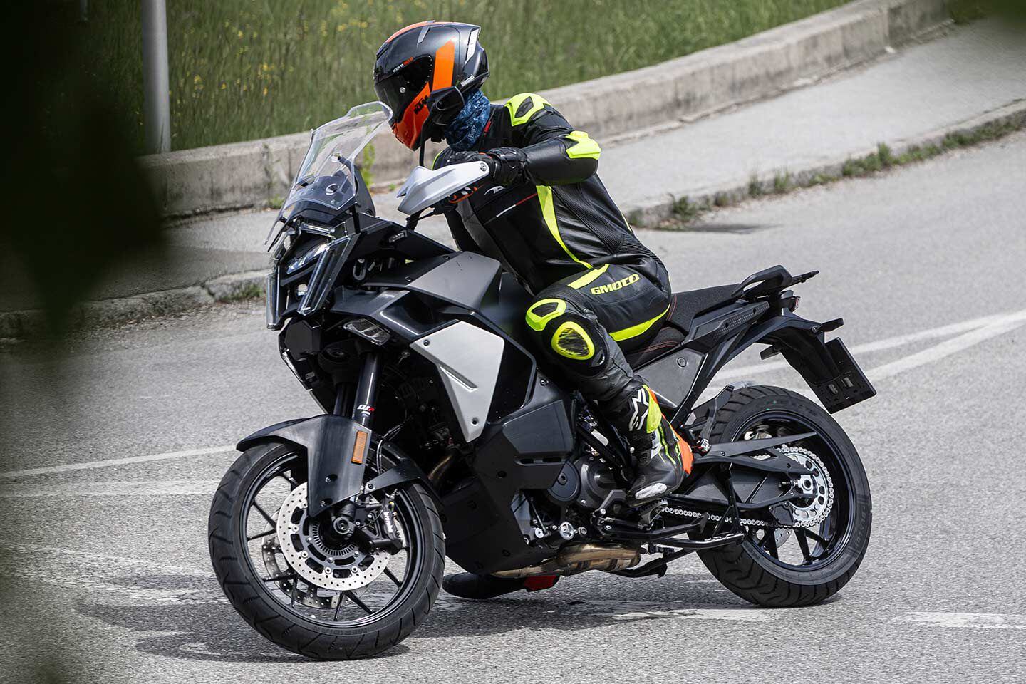 We believe this second model caught testing is the 2025 KTM 1390 Super Adventure S model. It features more street-oriented rubber and what appears to be a 19-inch front wheel instead of the Rally’s 21-incher.