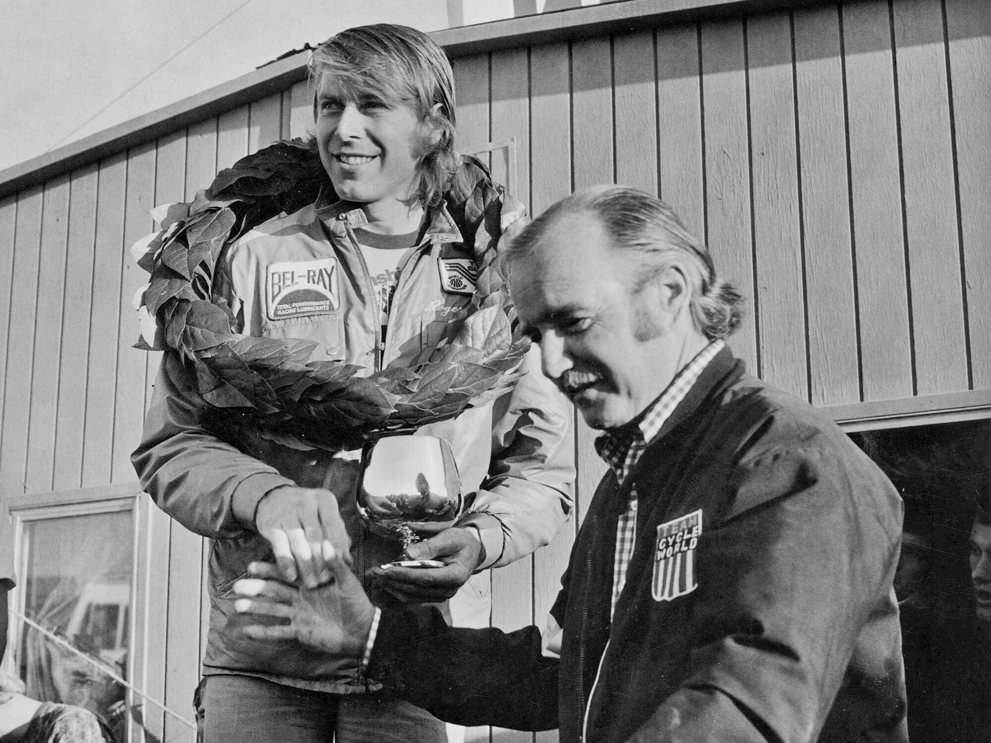 As co-founder of SoCal’s Saddleback Park, Parkhurst led motorcycle sport and recreation with one of the first dedicated off-road riding areas. It also hosted world-class racing and racers, including the 1975 Trans-AMA series. Here, Parky awards International Class Champion Roger DeCoster the silver trophy.