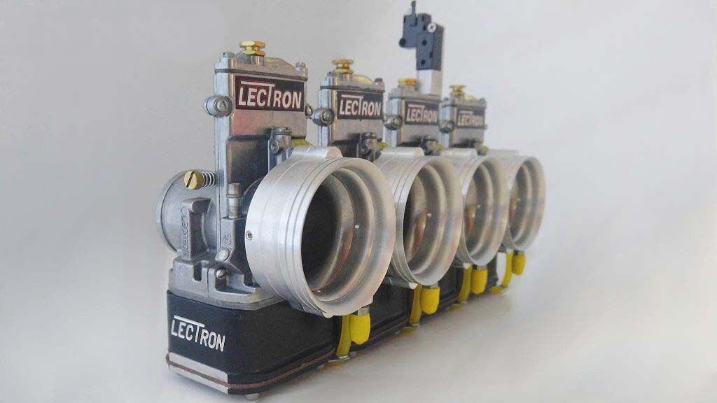 A bank of Lectron carbs for drag racing, complete with intake bells tapped for nitrous oxide.