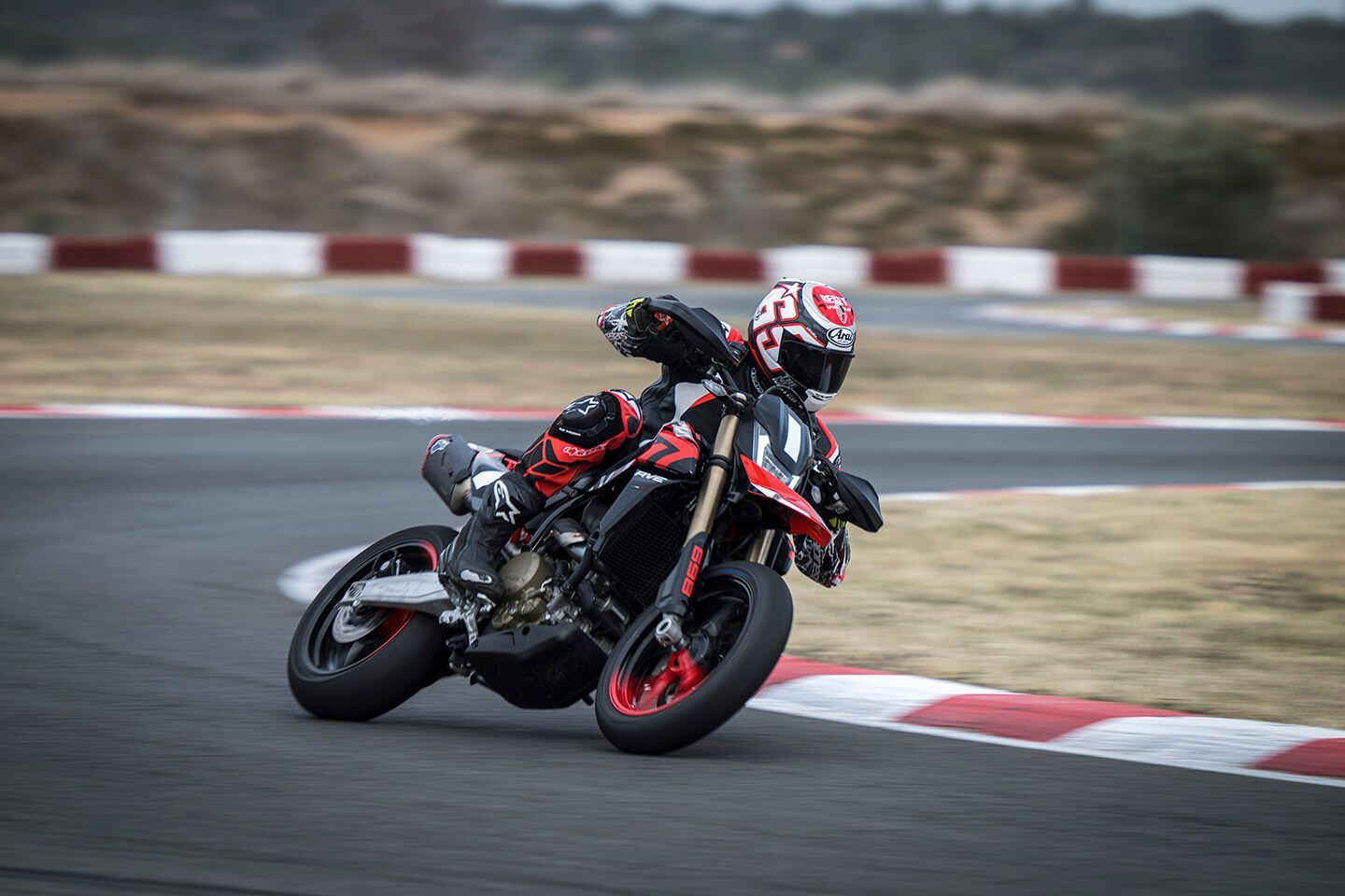 The stiffer the better. Bigger riders will notice that the rear moves quite a bit under acceleration. Front/rear weight bias is 48.5/51.5.
