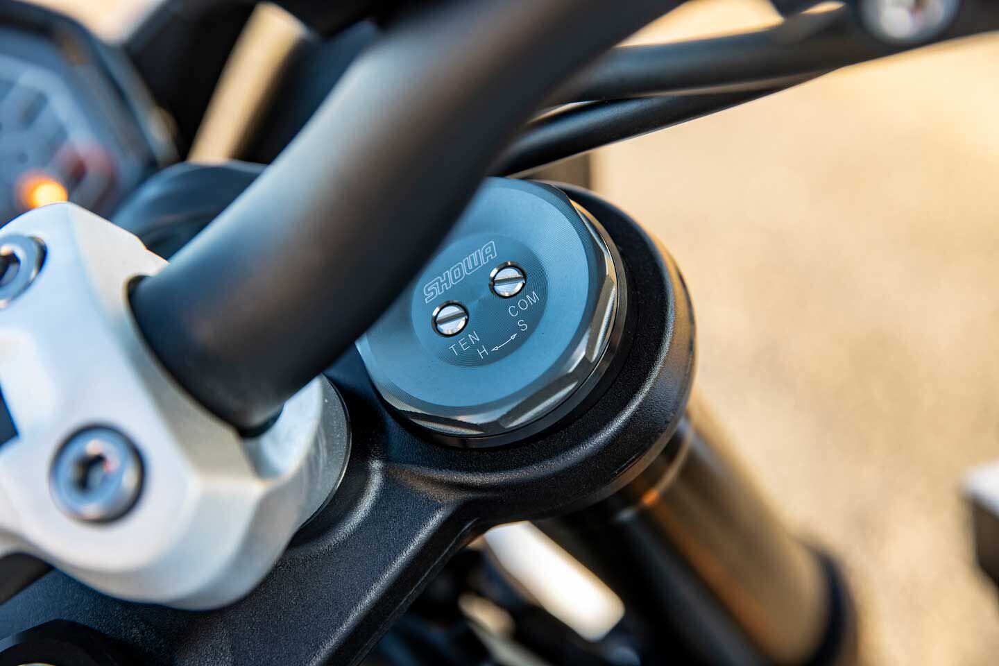 The R model gets a fully adjustable Showa fork.