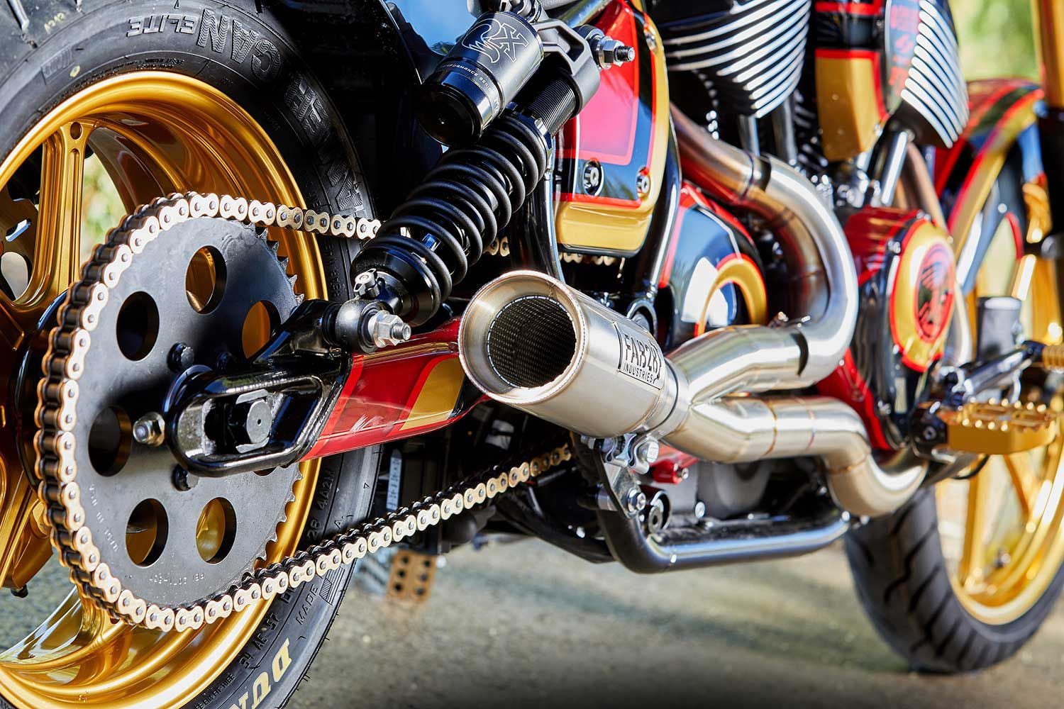 Replacing the stock model’s staggered dual exhaust is a 2-into-1 custom unit from Fab28 Industries; chain conversion is by Zipper’s.
