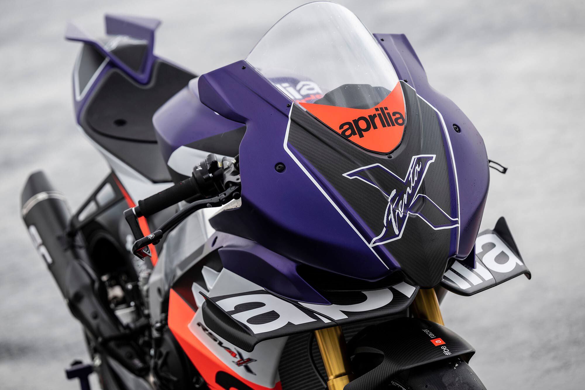 The livery takes styling cues from the Aprilia 125cc prototype used in 1992, the year the Noale-based OEM won its first of 54 world titles.