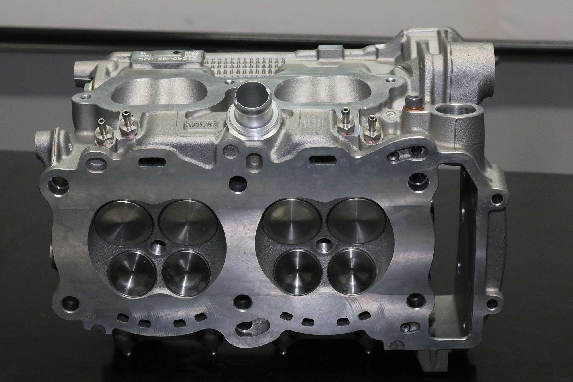 The Panigale V-4 desmo combustion chambers are cleanly profiled, with the valves set at a 25.5-degree included angle (12 degrees inlet and 13.5 degrees exhaust). Inlet valves have a 1.338-inch diameter, exhausts 1.082-inch.