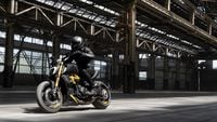 2023 ducati diavel 1260 s riding through industrial park