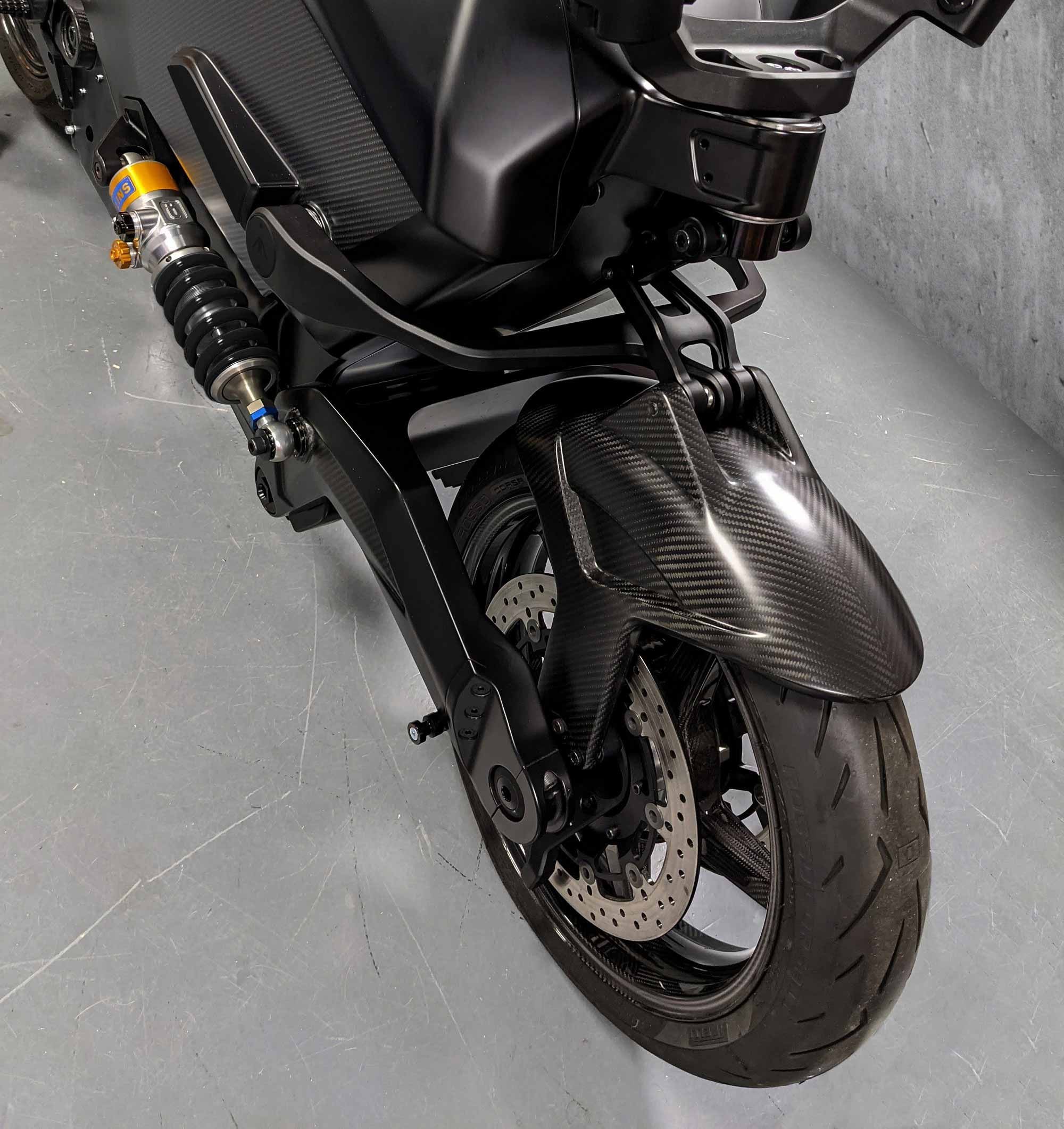As before, the bike features a hub-center-steered front end with wishbone style dual swingarms.